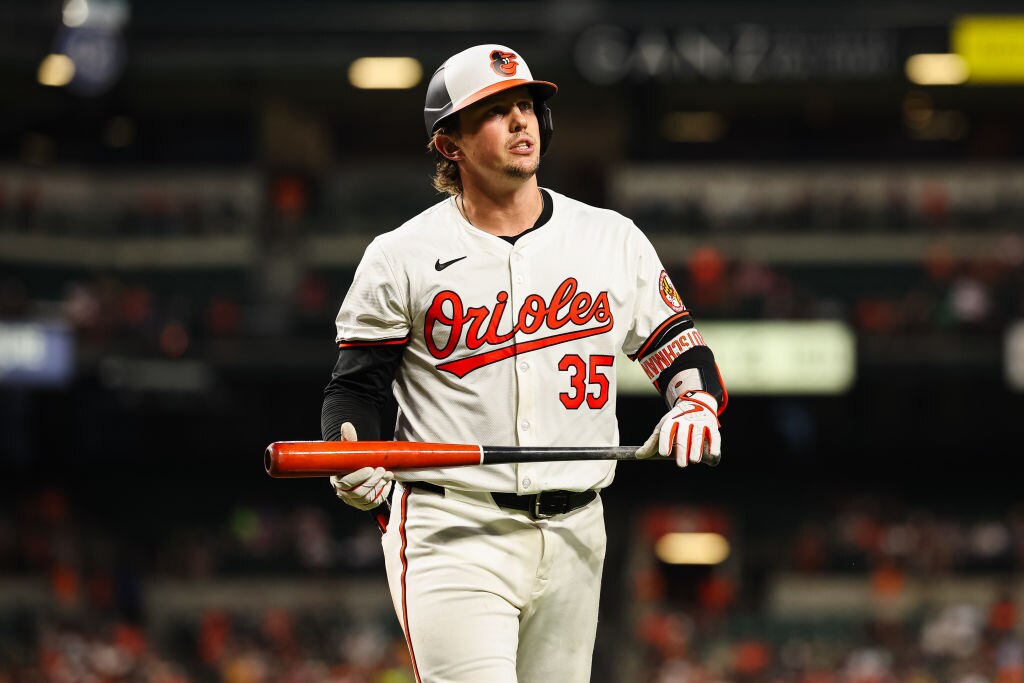 Adley Rutschman, #35 of the Baltimore Orioles, walks back to the dugout after striking out against the Boston Red Sox during the seventh inning. (Photo by Scott Taetsch/Getty Images)