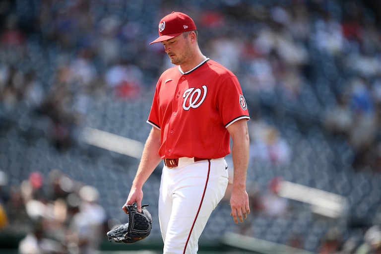 Washington Nationals relief pitcher Brad Lord walks back to the dugout after he was pulled during the eighth inning of a baseball game against the Pittsburgh Pirates, Sunday, July 5, 2026, in Washington. (AP Photo/Nick Wass)