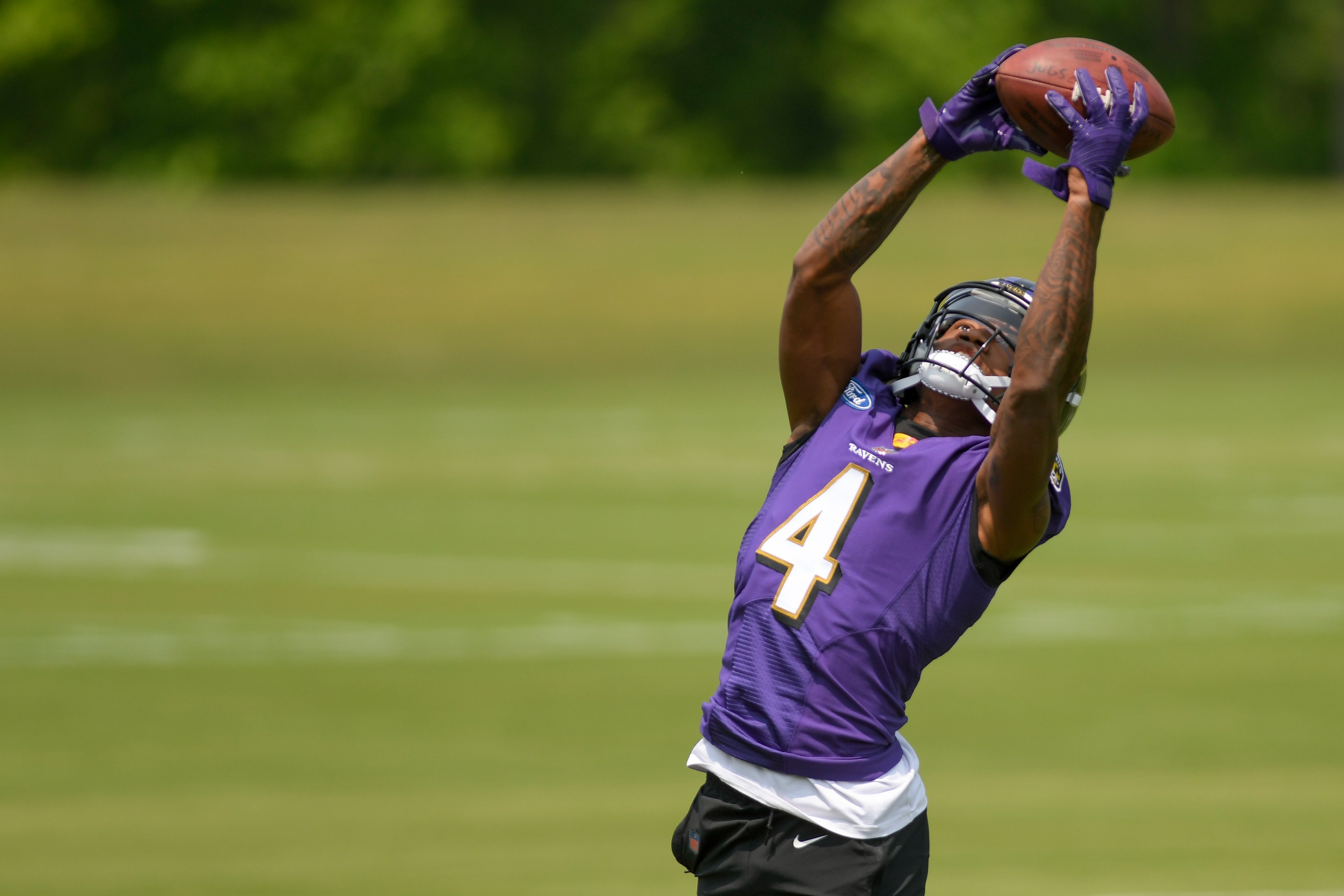 Ravens wide receiver Zay Flowers catches a pass Wednesday during organized team activities in Owings Mills.