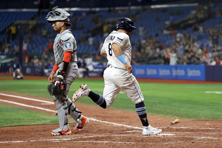 Tampa Bay Rays first baseman Jonathan Aranda scores behind Orioles catcher Carlos Narváez during the seventh inning.