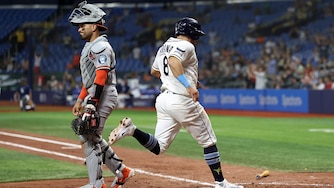 Tampa Bay Rays first baseman Jonathan Aranda scores behind Orioles catcher Carlos Narváez during the seventh inning.