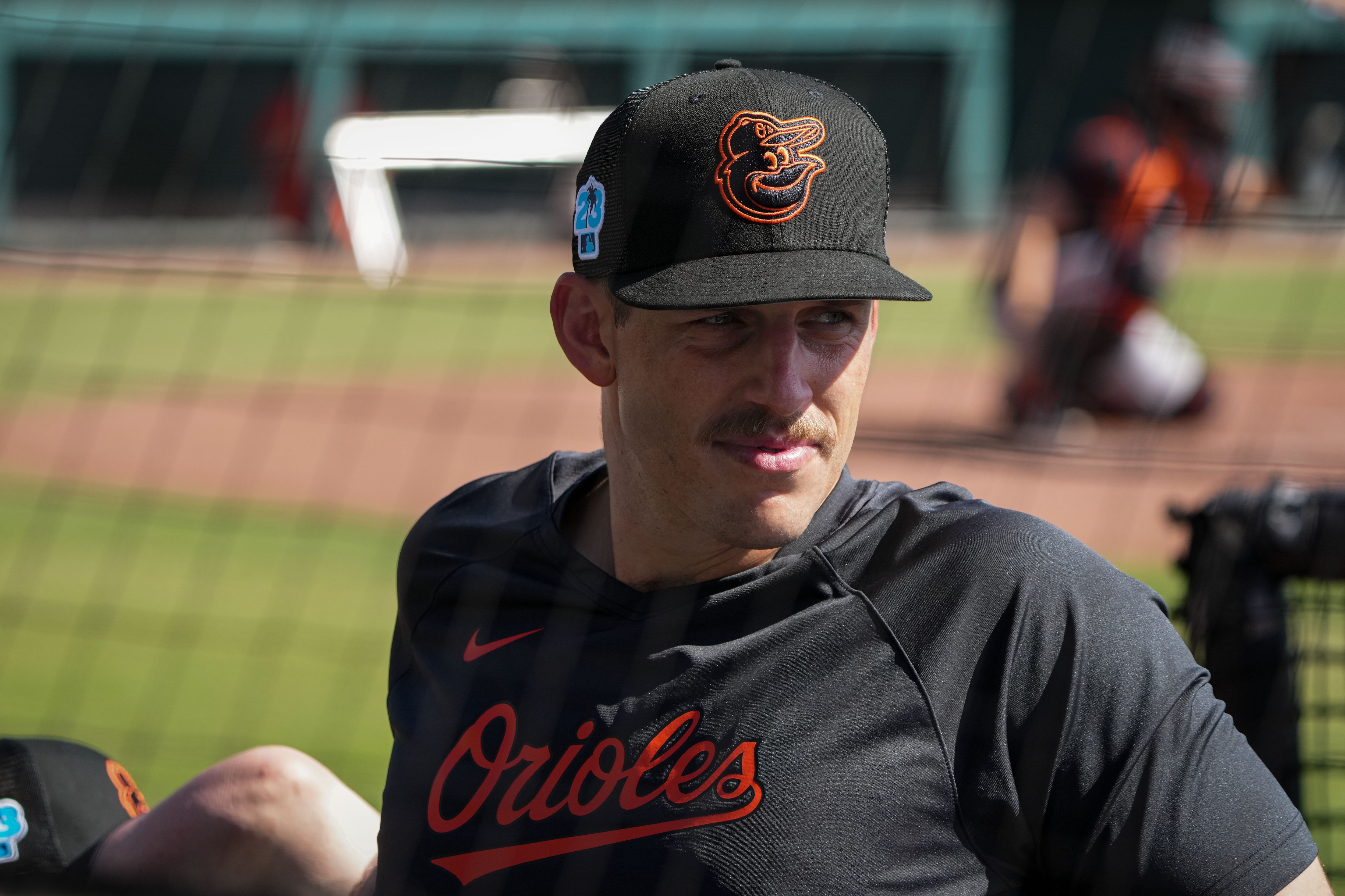 John Means watches practice at Ed Smith Stadium in Sarasota during spring training.