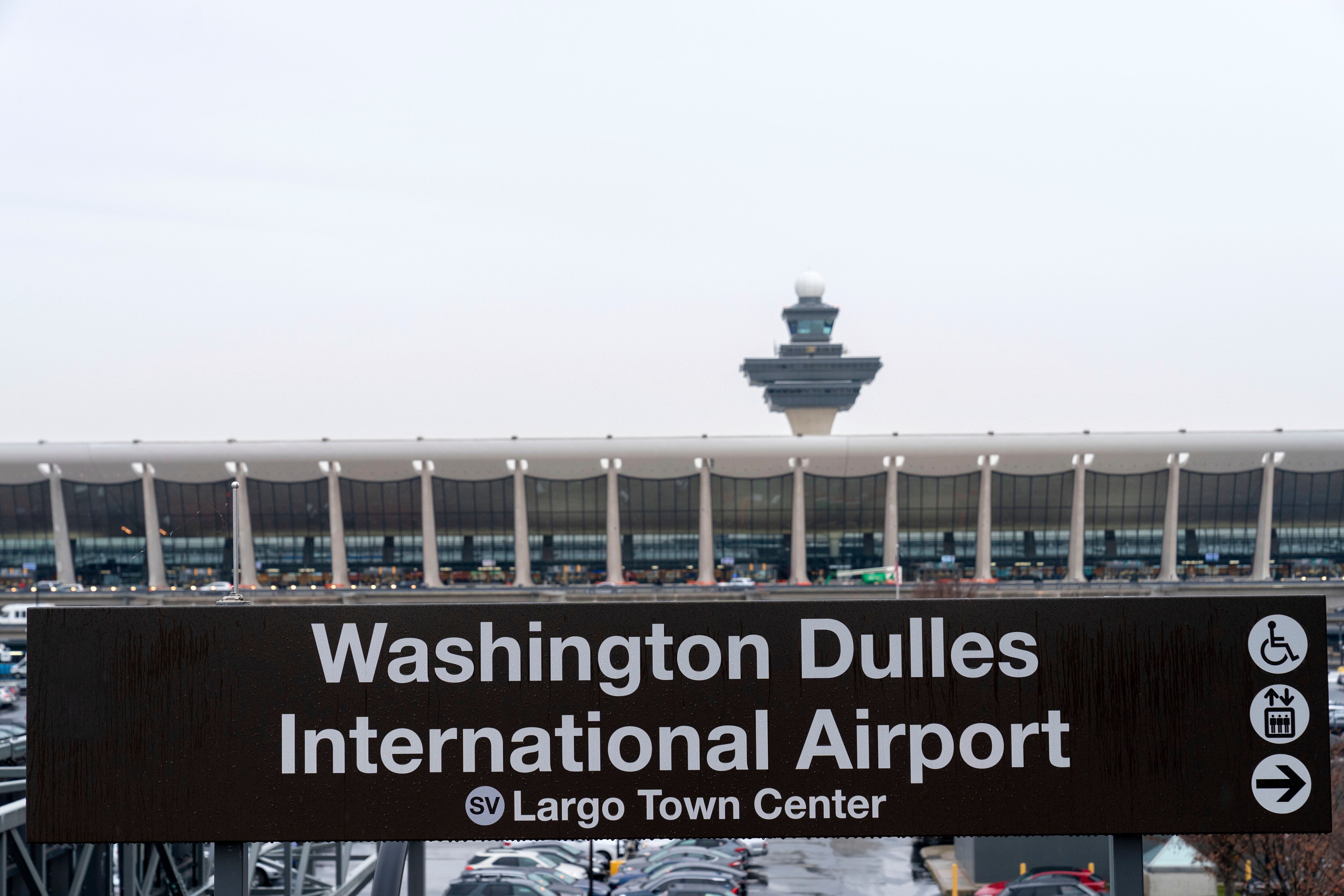 FILE - A sign of Washington Dulles International Airport station is seen during the opening of new Silver Line Extension at Washington Dulles International Airport, in Chantilly, Va., Nov. 15, 2022. (AP Photo/Jose Luis Magana, File)