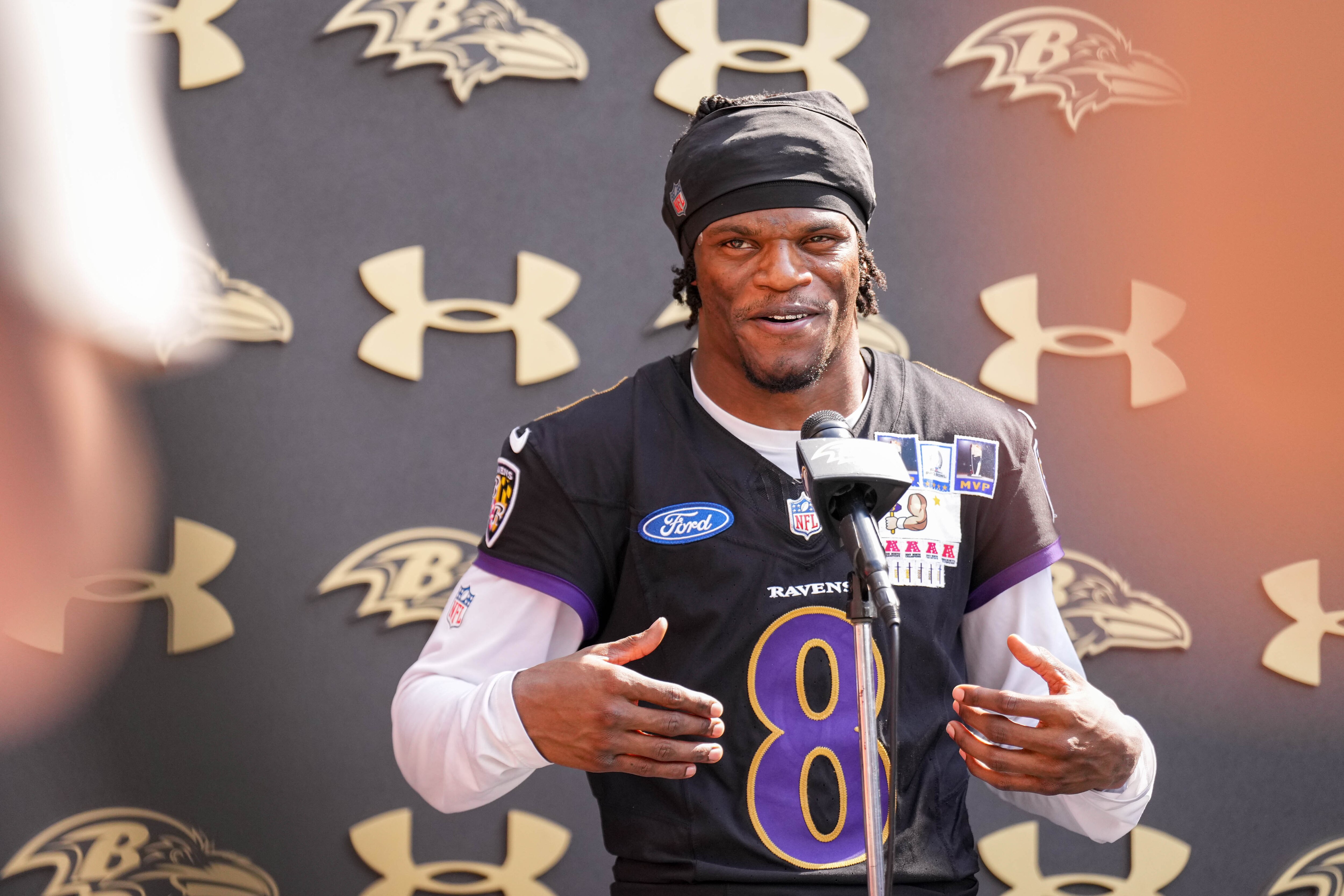 Lamar Jackson takes questions from reporters following the team’s training camp session on July 13.