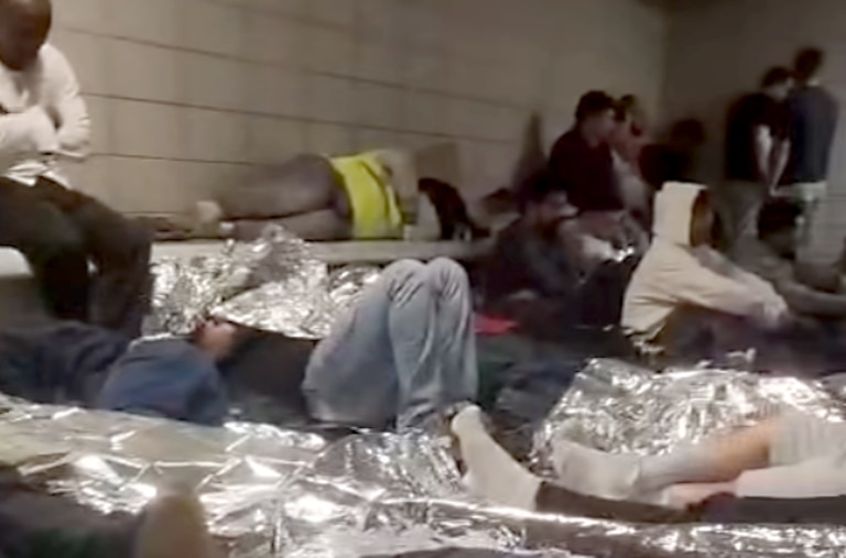 A partial screengrab from a video posted to social media purporting to show the inside of a holding room for undocumented immigrants in downtown Baltimore.