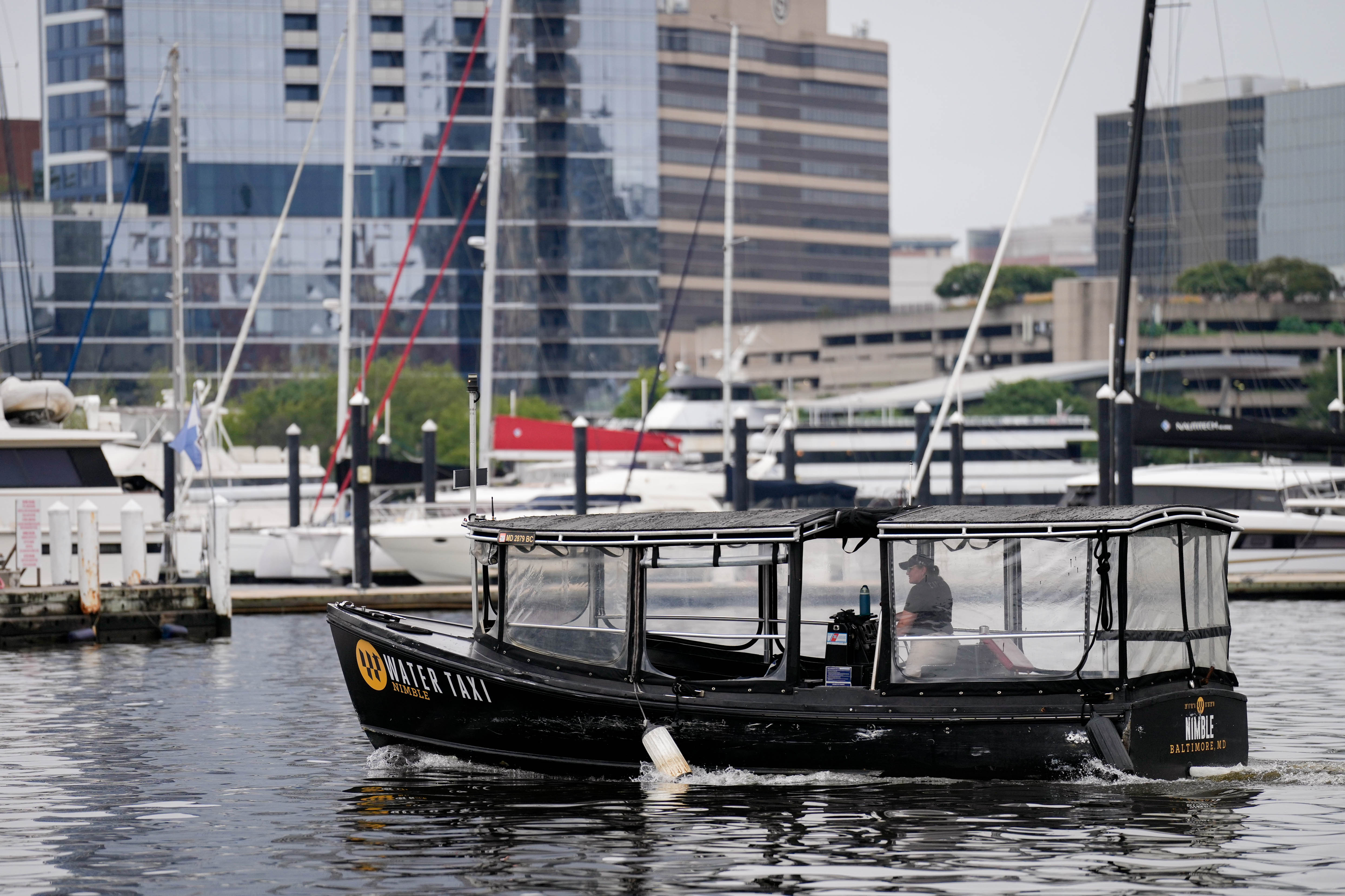 The Baltimore Water Taxi vessel “Nimble” cruises through the Inner Harbor in Baltimore last year.