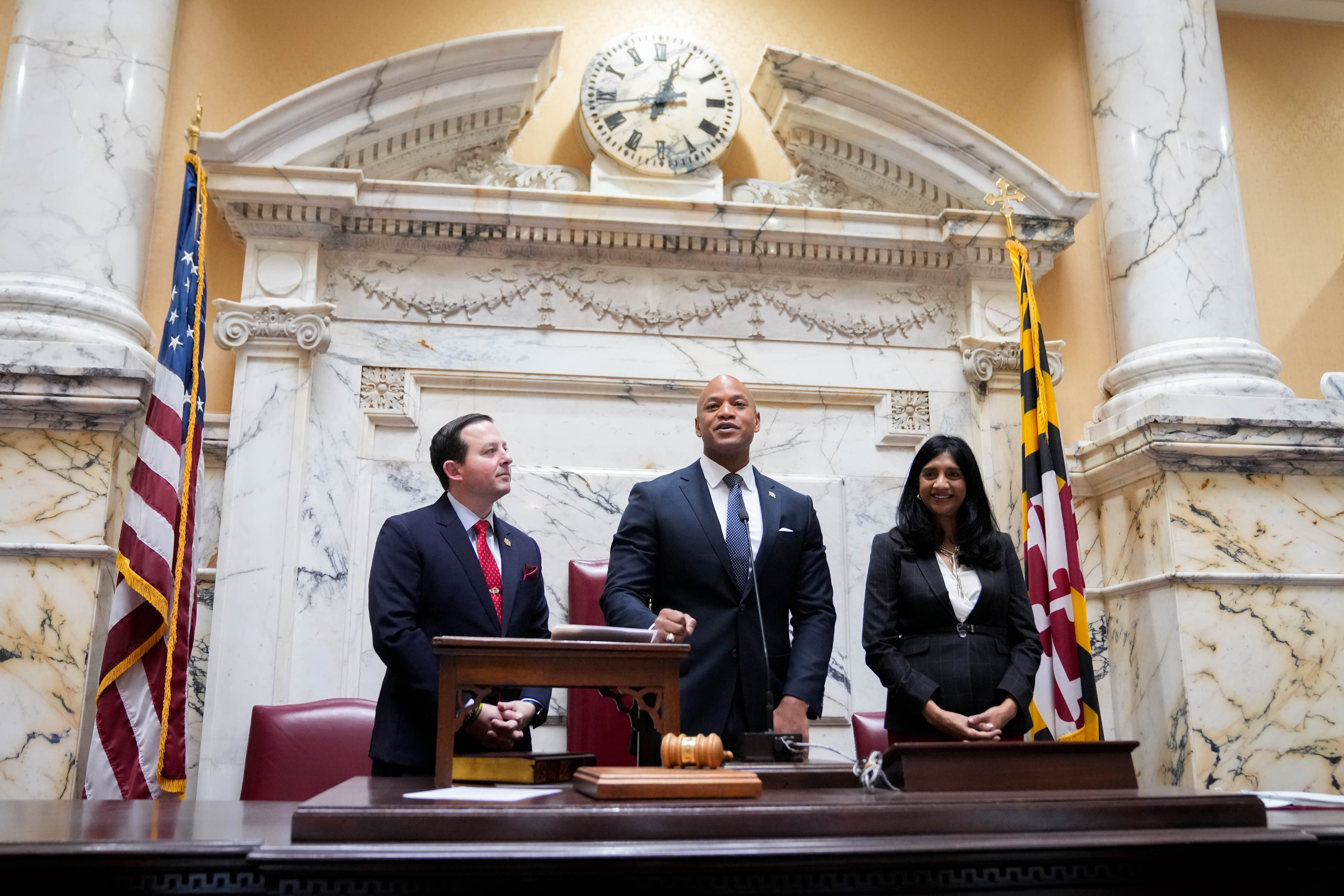 Maryland Gov. Wes Moore, flanked by Senate President Bill Ferguson and Lt. Gov. Aruna Miller, gives remarks during the first day of the General Assembly session in the Maryland State House in Annapolis, Md. on Wednesday, January 8, 2025.