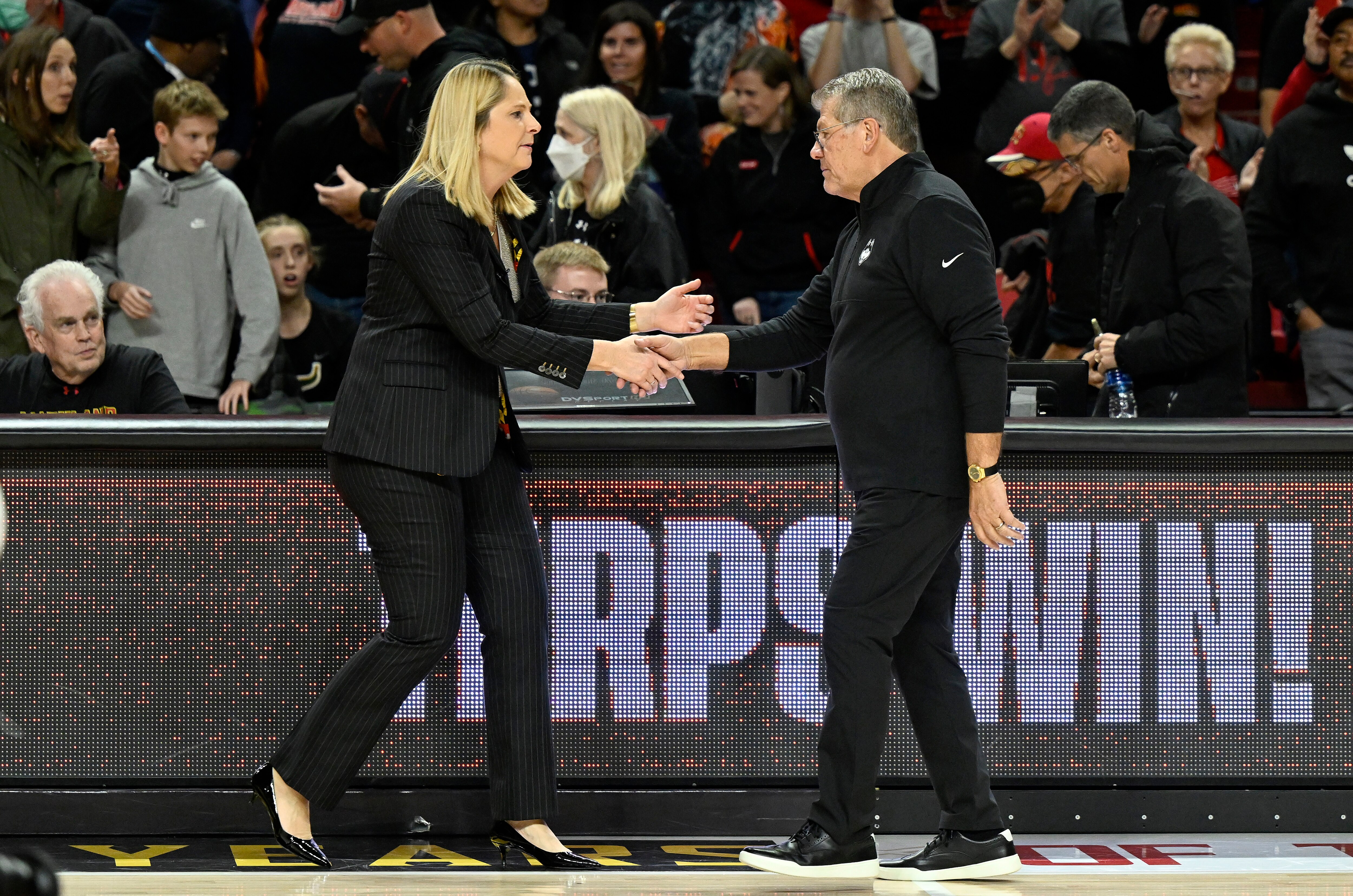 COLLEGE PARK, MARYLAND - DECEMBER 11: Head coach Brenda Frese of the Maryland Terrapins shakes hands with head coach Geno Auriemma of the UConn Huskies after the game at Xfinity Center on December 11, 2022 in College Park, Maryland. (Photo by Greg Fiume/Getty Images)
