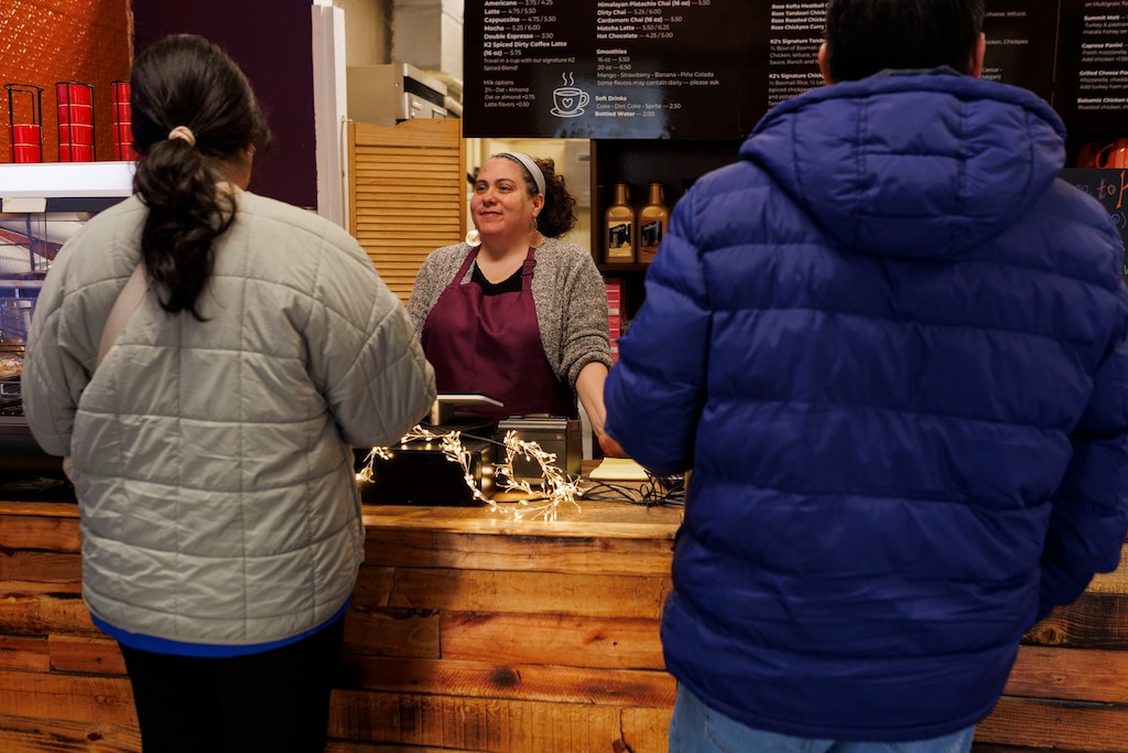 Wednesday, Feb. 4, 2026, in Clarksburg, MD— Nichole Hodges-Abbasi, owner of K2 Cafe, takes an order from a customer.