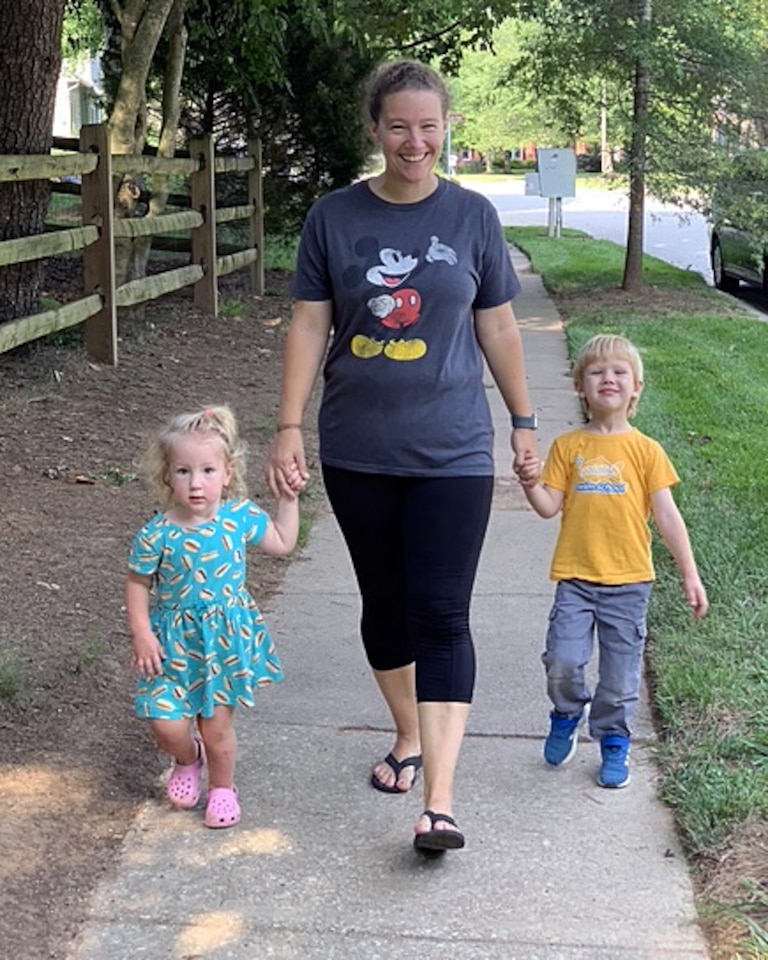 Emily Rieger with her children Liam and Ryanne, walking around one a neighborhood path.