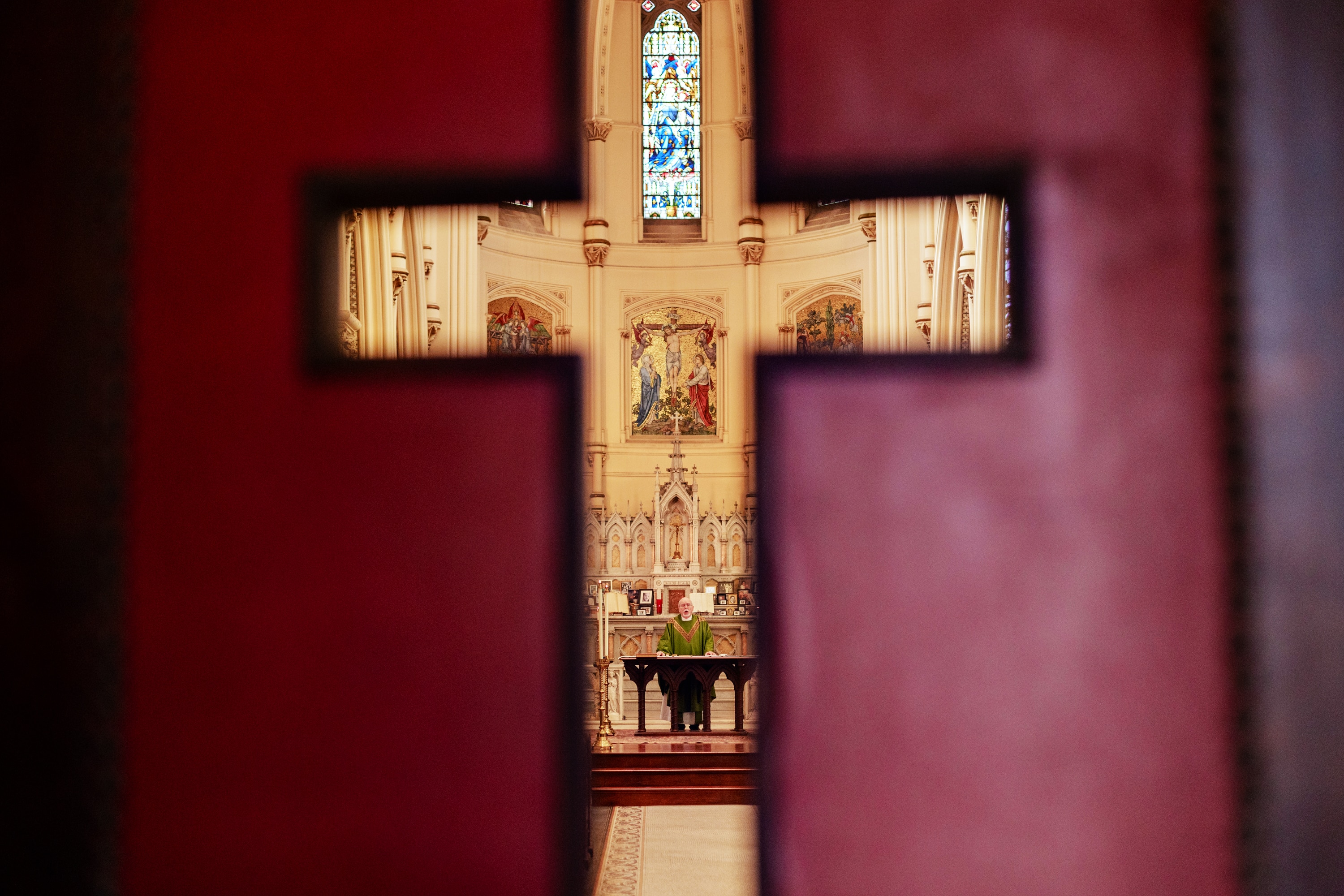 The Rev. Martin Demek prepares for the second-to-last Sunday mass at the Corpus Christi church in Baltimore on Nov. 17.