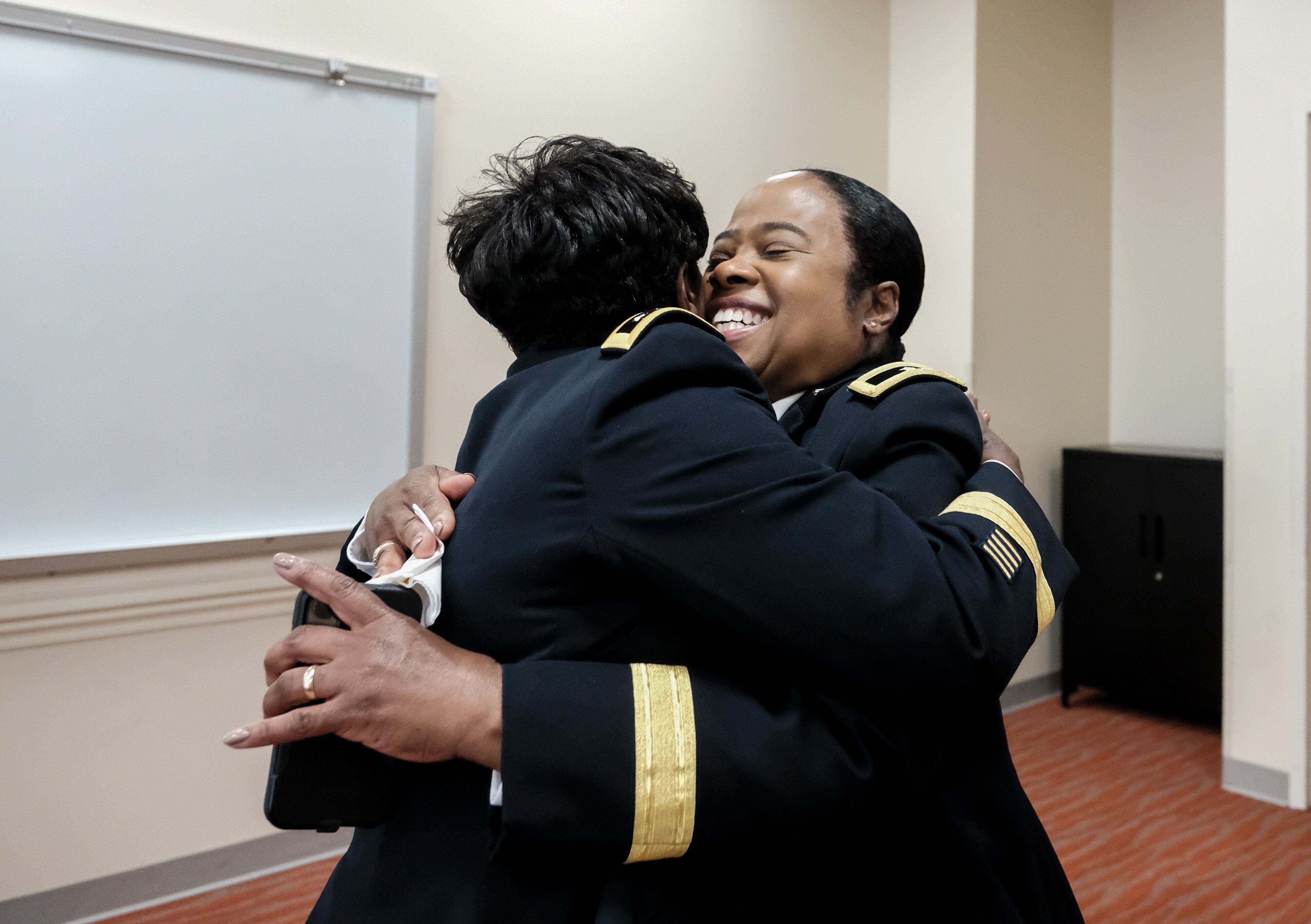 Brig. Gen. Janeen Birckhead is greeted by her mentor and the highest ranking Black woman in the U.S. Army, Lt. Gen. Donna Martin, prior to her promotion ceremony on June 3 at Morgan State University.