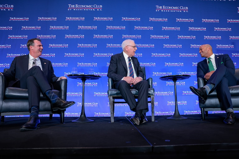 WASHINGTON, DC - FEBRUARY 18: David Rubenstein (C) interviews Maryland Gov. Wes Moore (R) and Oklahoma Gov. Kevin Stitt (L) at the Economic Club on February 18, 2026 in Washington, DC. As Chair and Vice Chair of the National Governors Association, Stitt and Moore discussed the NGA’s bipartisan “Reigniting the American Dream” initiative. (Photo by Heather Diehl/Getty Images)