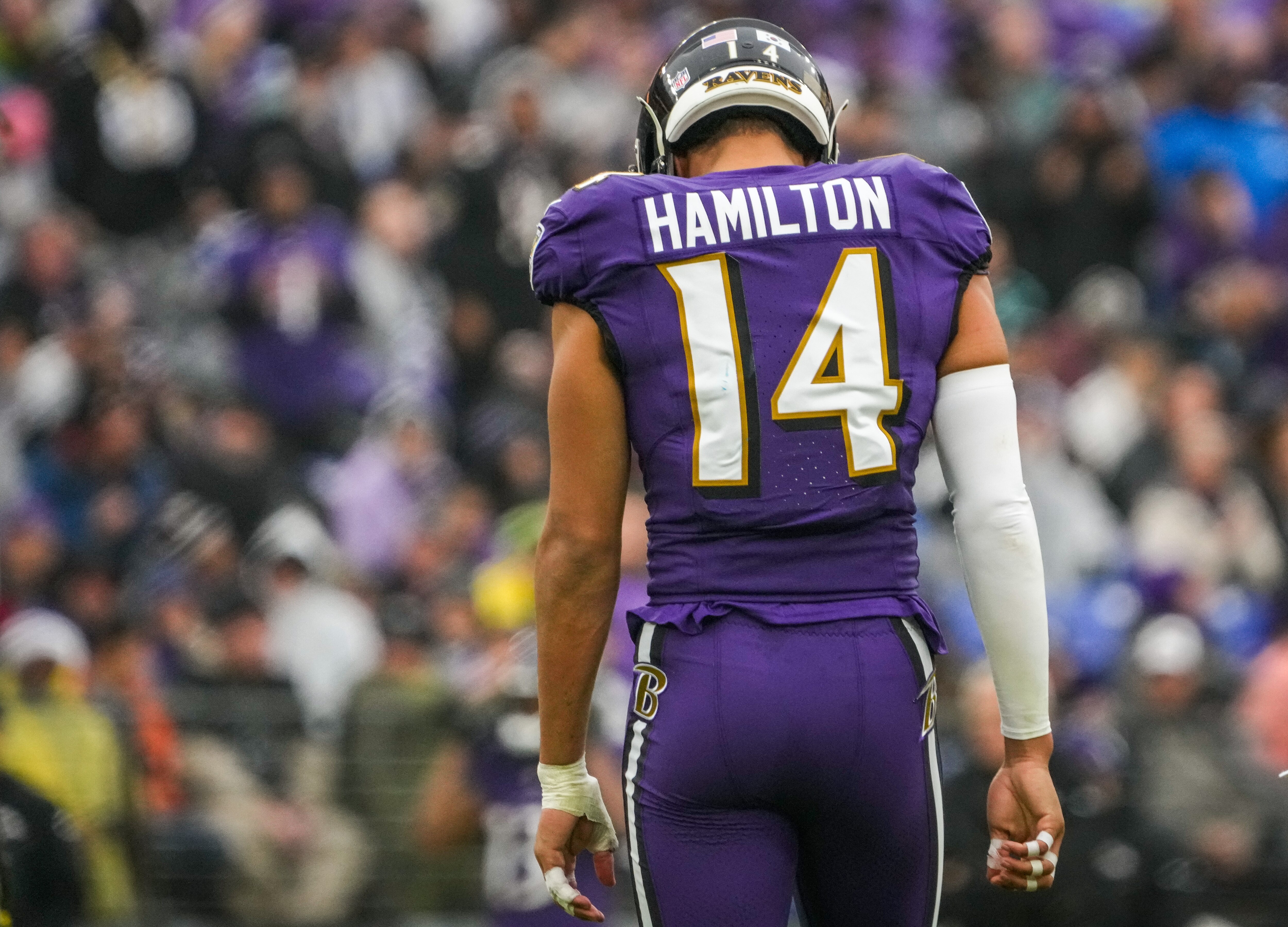 Baltimore Ravens safety Kyle Hamilton (14) walks between plays during the first quarter against the Los Angeles Rams at M&T Bank Stadium on Sunday, Dec. 10, 2023.