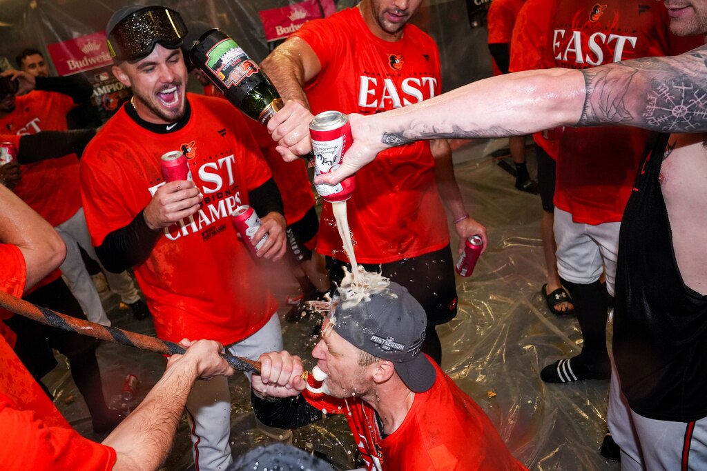 The Baltimore Orioles douse each other with champagne and beer in the locker room after clinching the AL East division on Thursday, September 28, 2023. The beat the Boston Red Sox, 2-0, to secure control of the division.