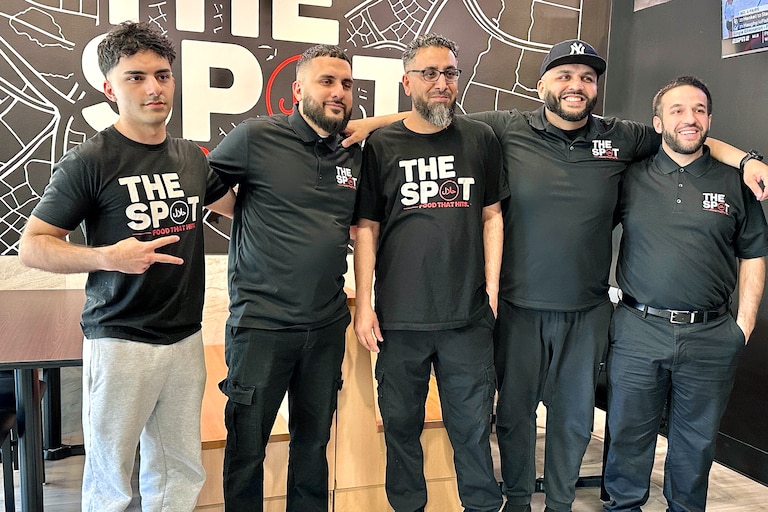 From left, Moe Woodod, Sip Woodod, Adnan Azam, Kareem Woodod and Abdul Ghani celebrate the opening of The Halal Spot’s Owings Mills location.