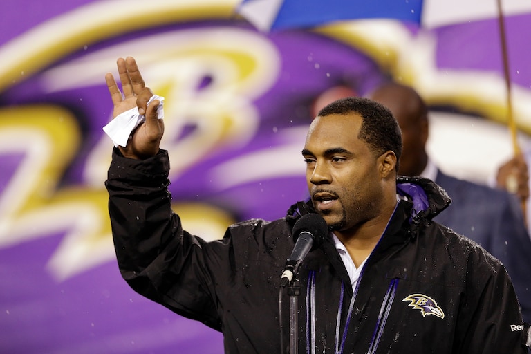 Former Baltimore Ravens player Jamal Lewis waves during the Ring of Honor induction ceremony during halftime in the NFL football game between the Baltimore Ravens and Cleveland Browns in Baltimore, Thursday, Sept. 27, 2012. (AP Photo/Patrick Semansky)