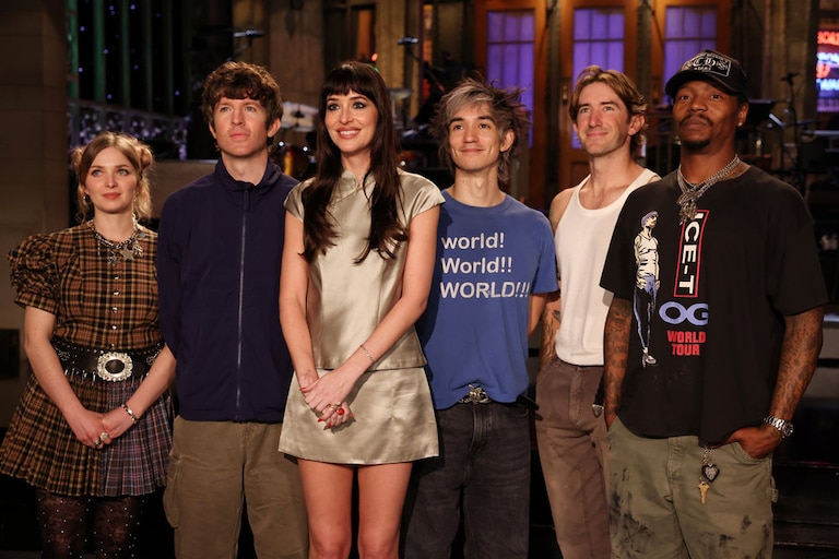 SATURDAY NIGHT LIVE -- Episode 1906 -- Pictured: Host Dakota Johnson (center) with musical guest Turnstile during Promos on Thursday, October 1, 2026 -- (Photo by: Rosalind O'Connor/NBC)