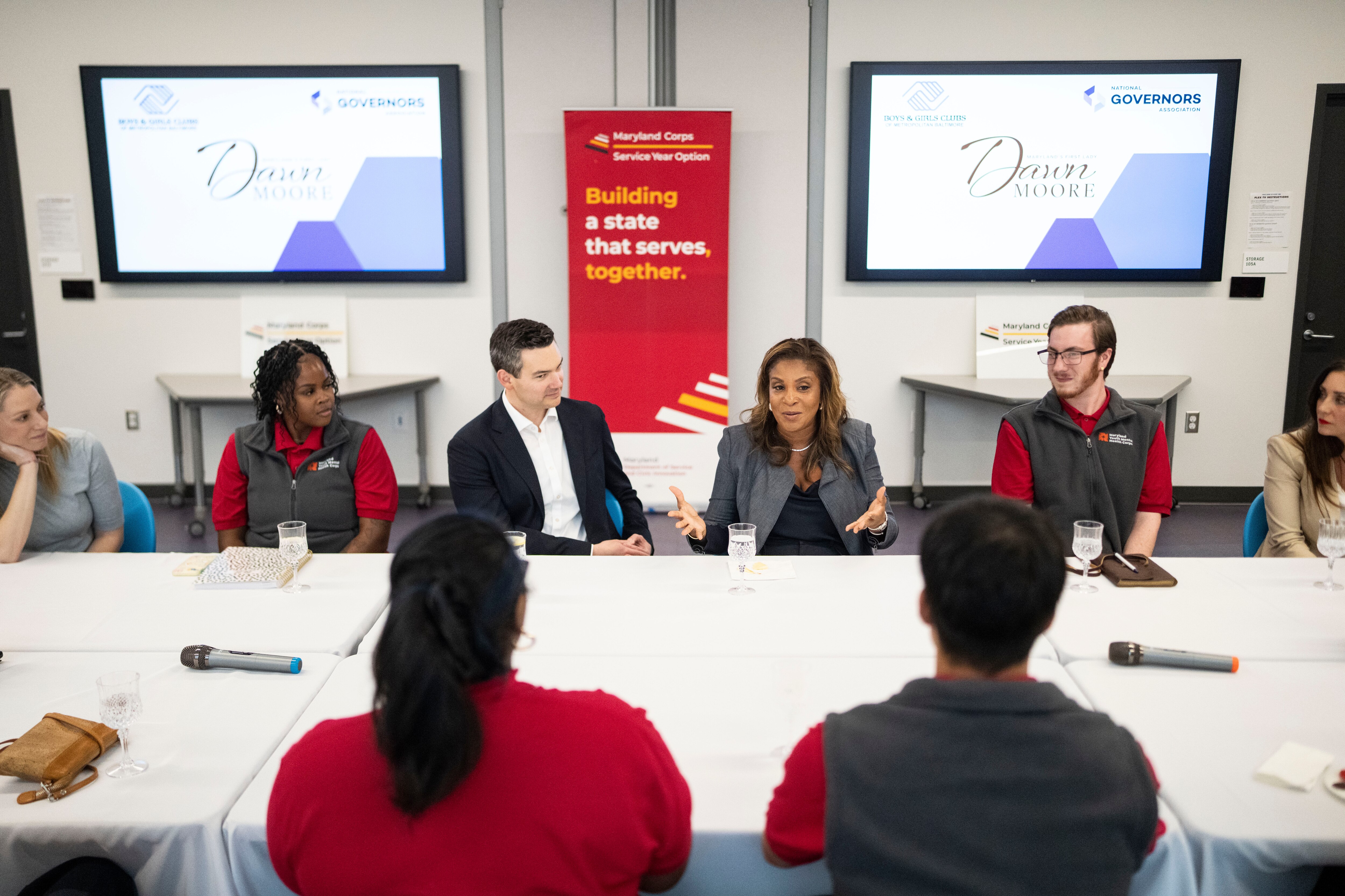 First lady Dawn Moore, center, at a roundtable with Youth Mental Health Corps members and first ladies from around the country at the Baltimore Ravens Boys & Girls Club on Wednesday.