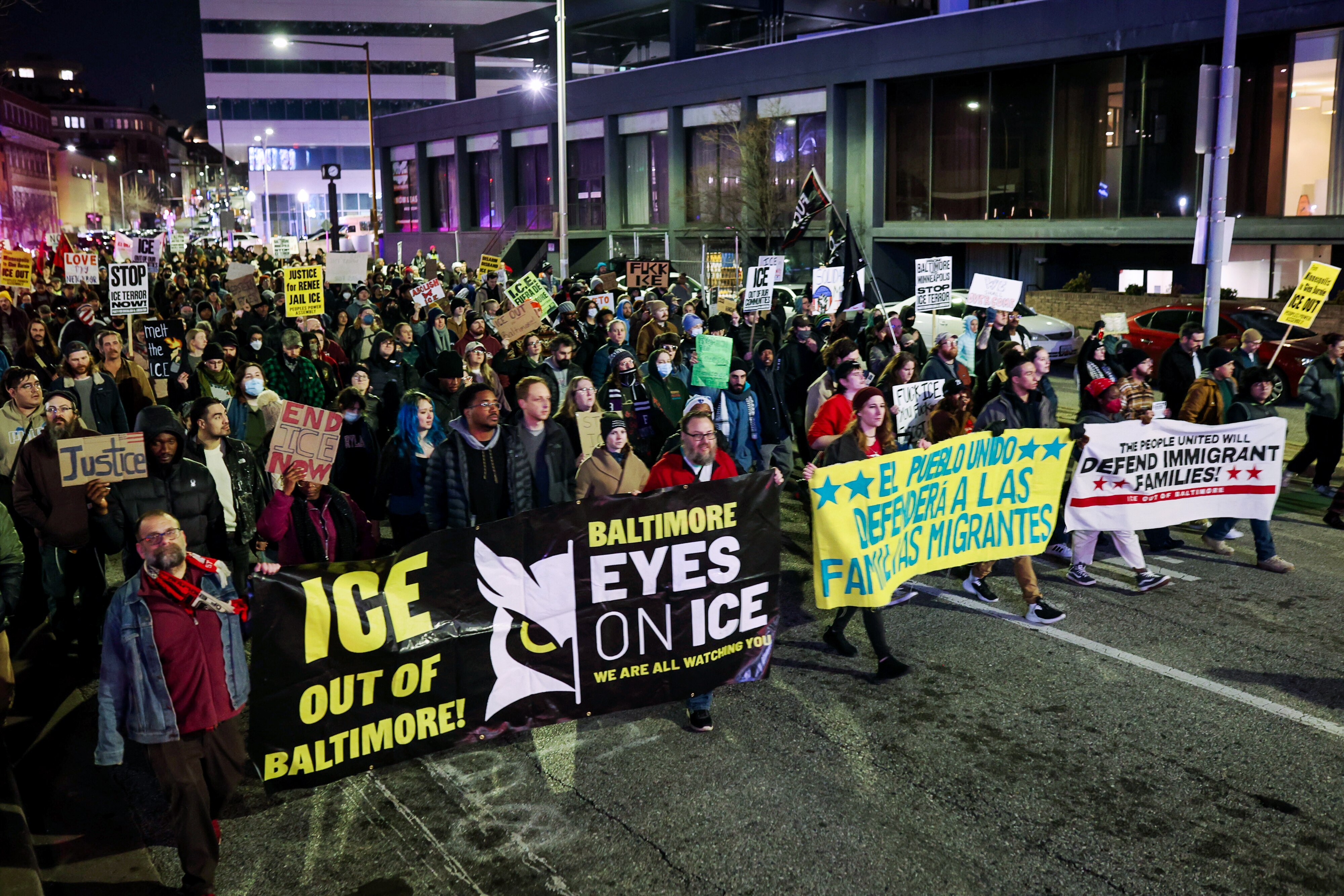People march through downtown Baltimore to protest on Thursday after a woman was shot and killed by ICE in Minneapolis the previous day.
