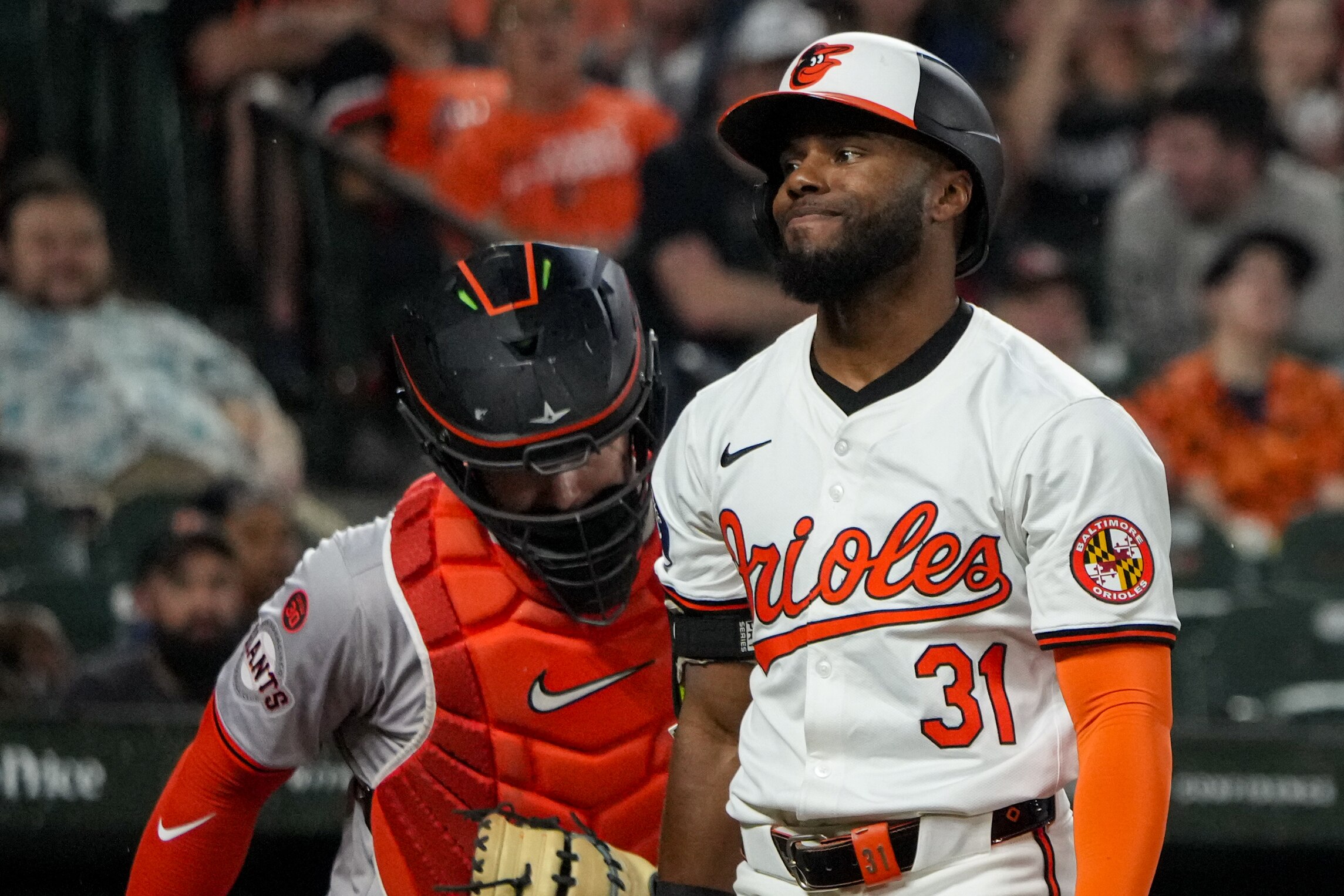 Orioles outfielder Cedric Mullins (31) grimaces after striking out.