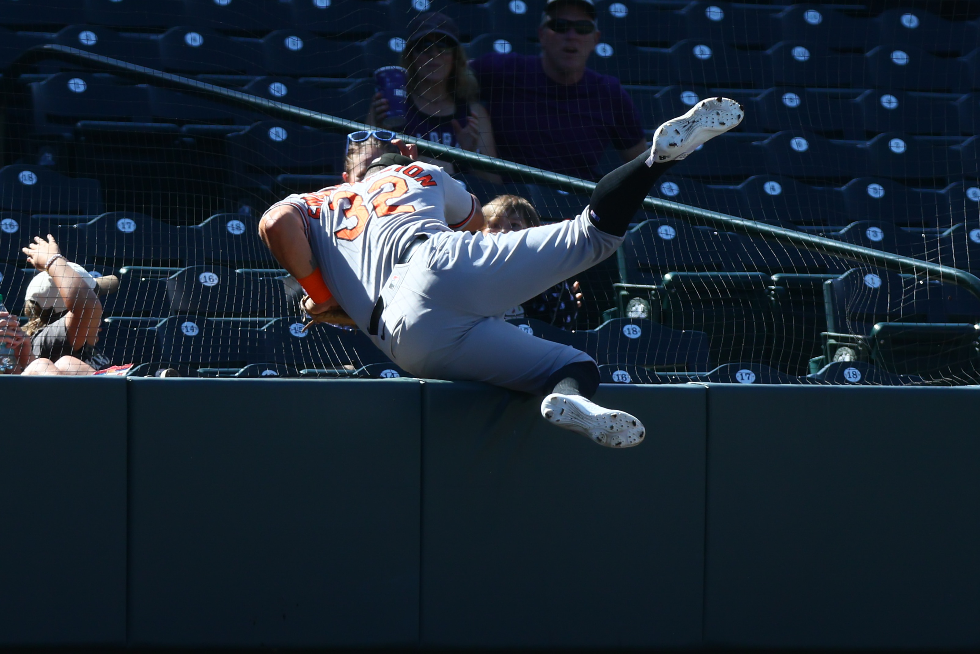 Orioles third baseman Christian Encarnacion-Strand hits the wall after catching a ball in foul territory in the eighth inning Wednesday at Colorado.