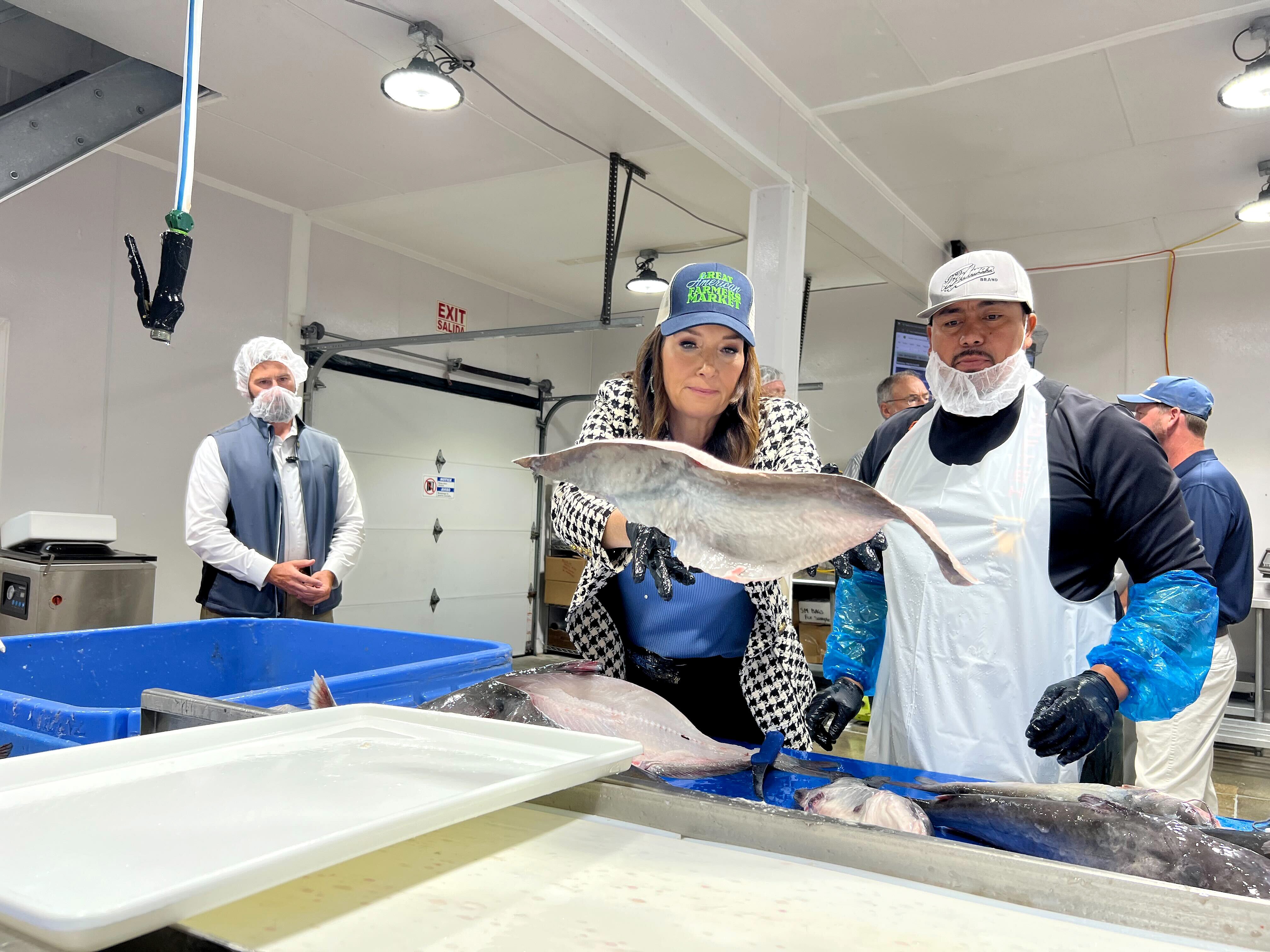 US Secretary of Agriculture Brooke Rollins and employees at Tilghman Island Seafood, the only USDA-certified blue catfish processing facility on the Eastern Shore.