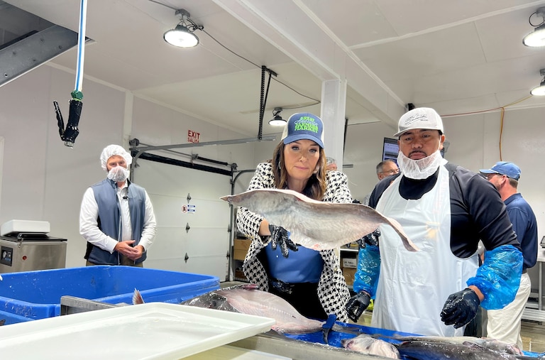 US Secretary of Agriculture Brooke Rollins and employees at Tilghman Island Seafood, the only USDA-certified blue catfish processing facility on the Eastern Shore.