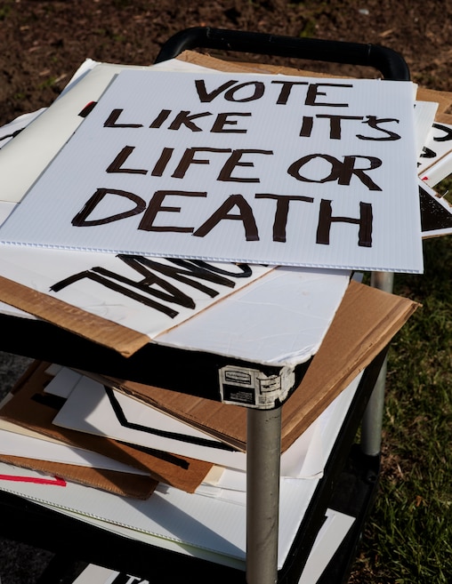 Senior activists meet up every Wednesday on the corner of 40th Street and Roland Avenue in Hampden to protest actions of the Trump administration. People can bring their own signs or borrow one provided by organizer Karl Alexander.