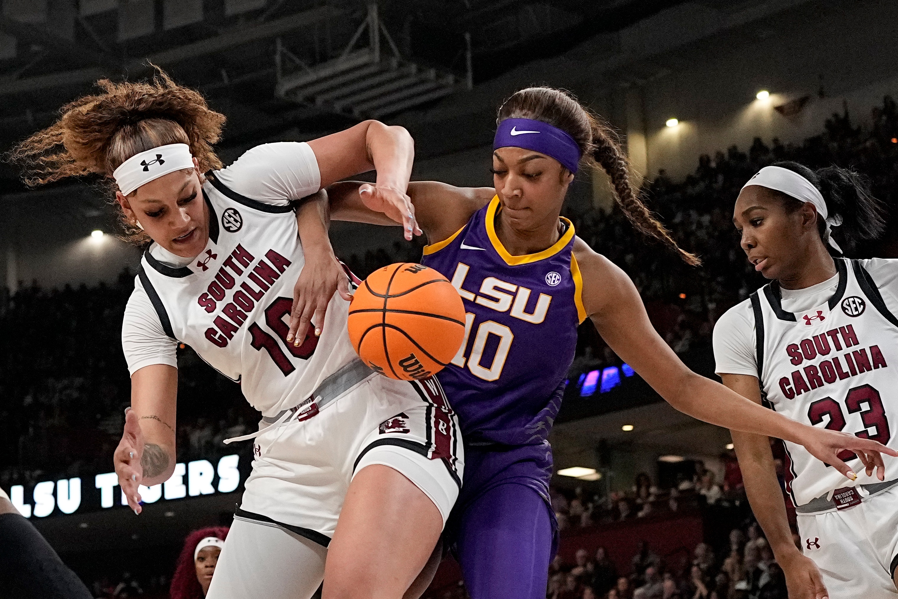 South Carolina center Kamilla Cardoso vies for the ball with LSU forward Angel Reese during the first half of Sunday's SEC championship game.