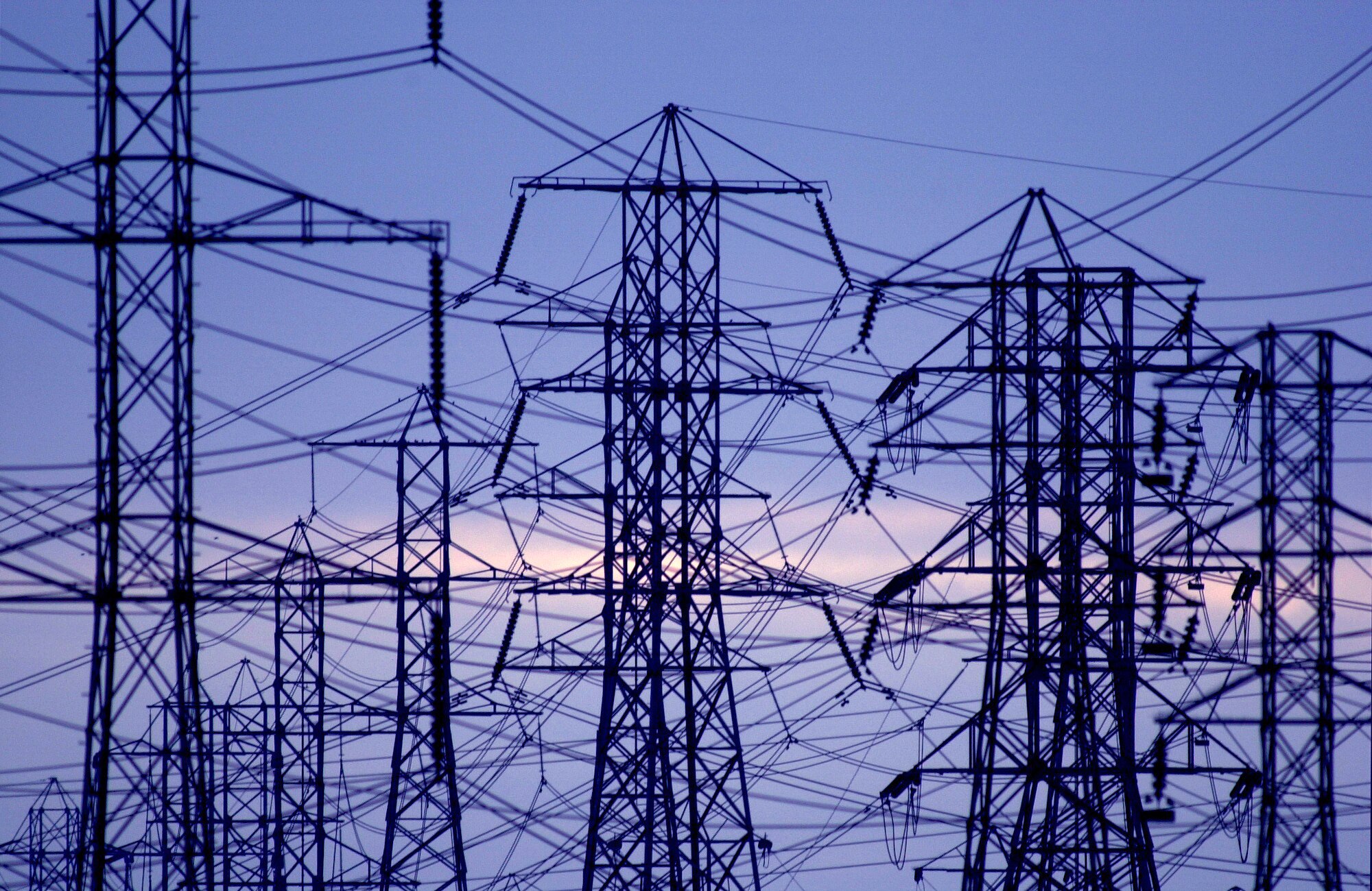 A view of the power lines as evening settles December 11, 2000 in Pico Rivera, CA. California residents statewide are urged to delay turning on their holiday lights until 7 P.M. each evening to prevent electrical blackouts. Several stage two emergencies, when electrical reserves in the region drop to 5 percent or less, have been declared in recent days.