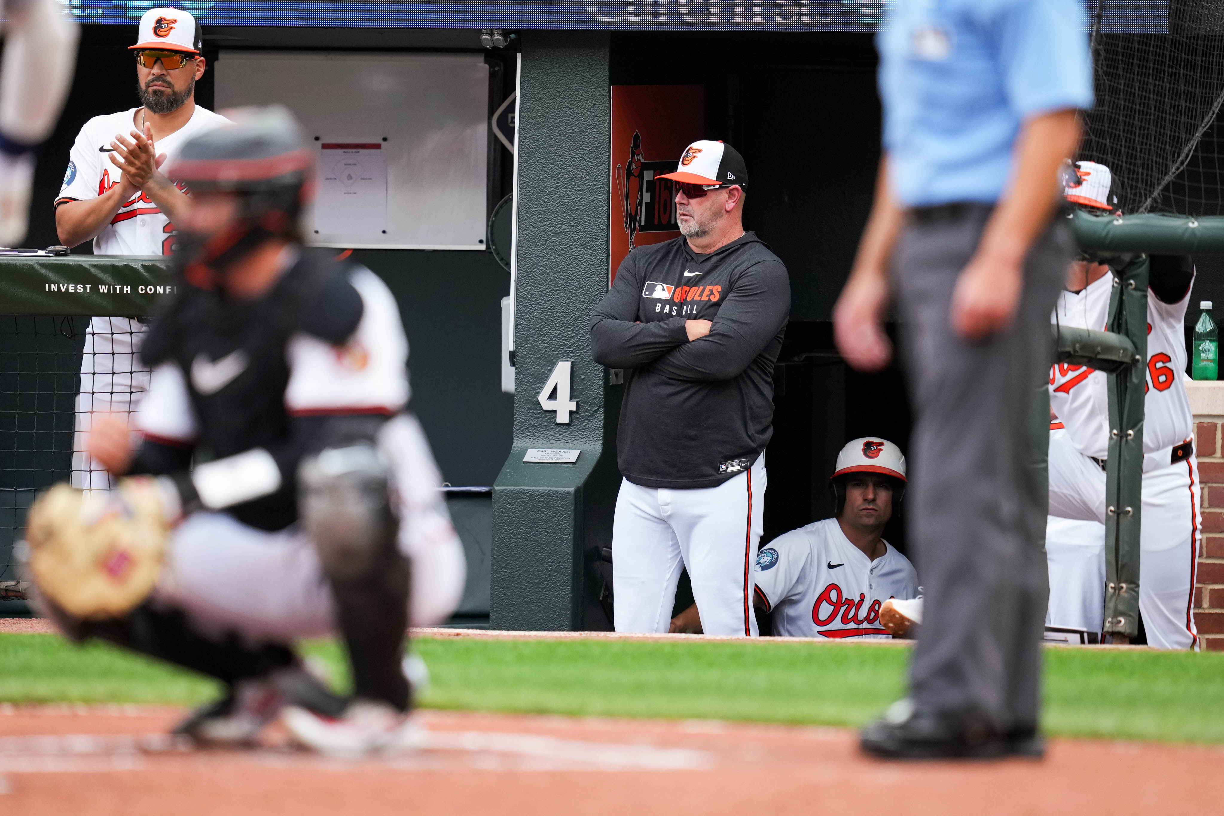 Former Orioles manager Brandon Hyde observes players from the dugout during the team’s home opener on March 31.