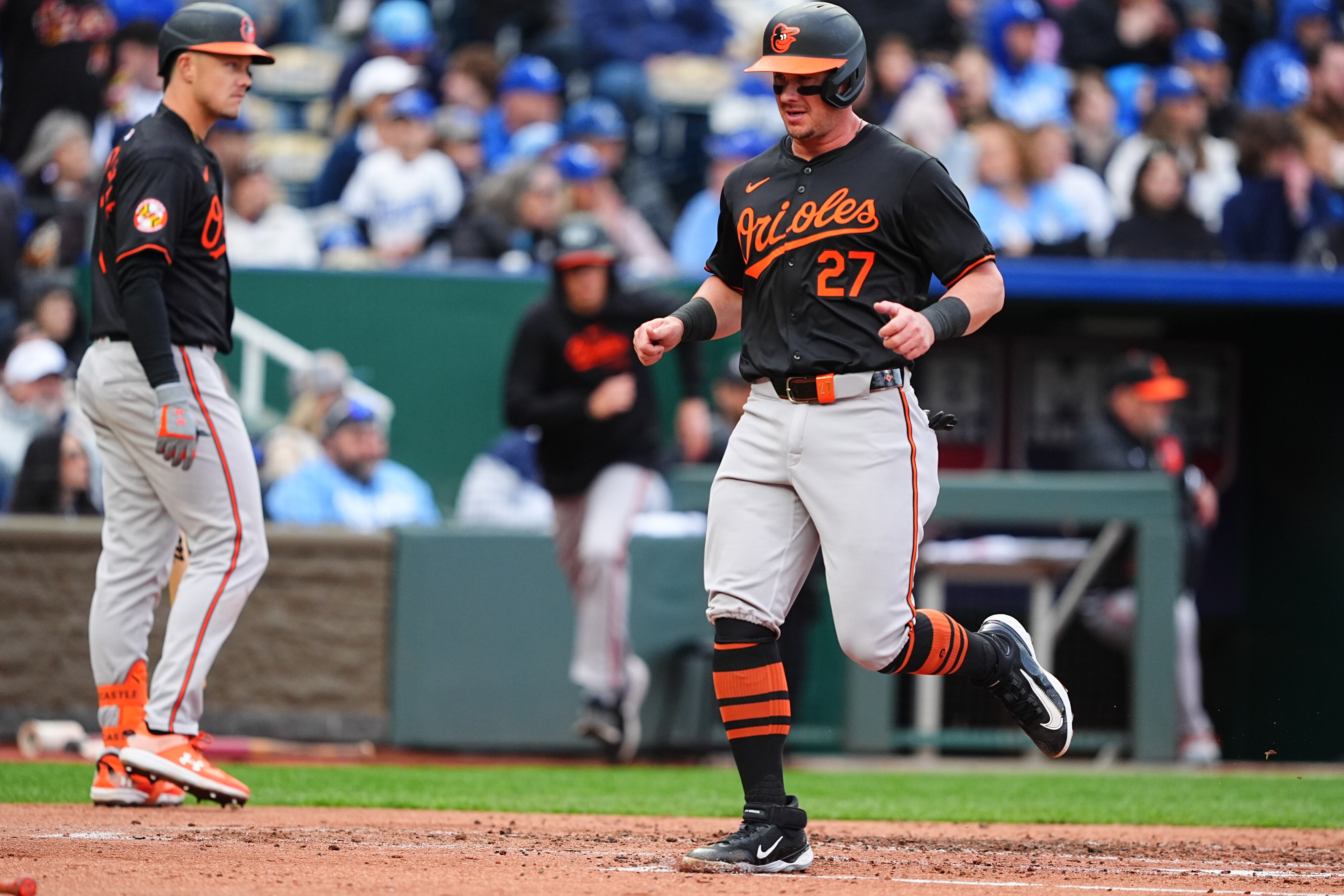 Orioles catcher James McCann scores one of seven second-inning runs Saturday night in a 9-7 win over the Royals.