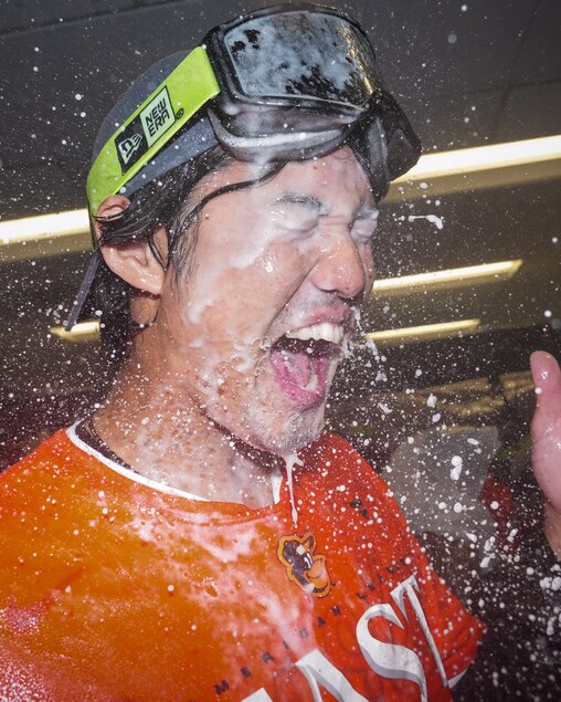 Baltimore Orioles pitcher Shintaro Fujinami gets doused with champagne in the locker room after clinching the AL East division on Thursday, September 28, 2023. The beat the Boston Red Sox, 2-0, to secure control of the division.
