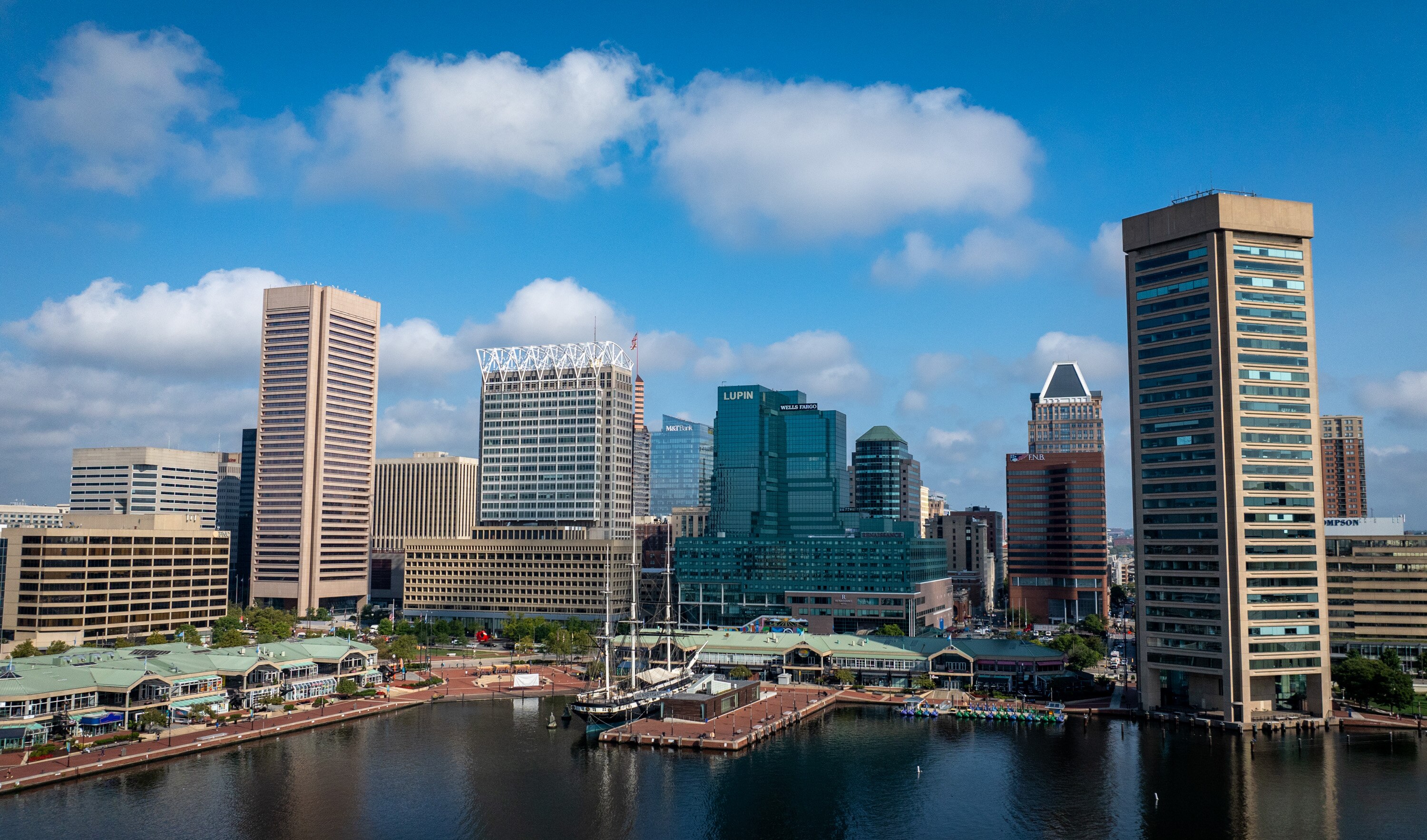The Baltimore skyline is seen above the Harborplace pavilions and the Inner Harbor.