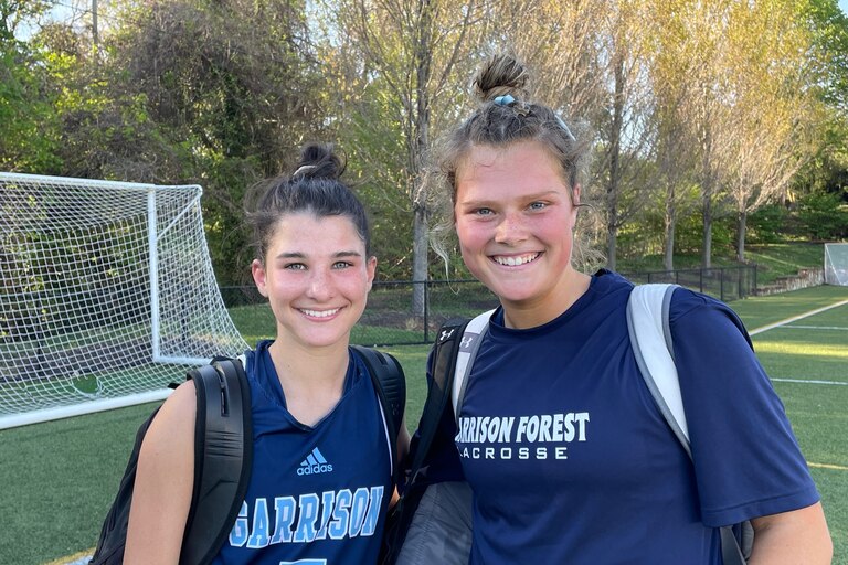 Gabby Laverghetta (5) scored five goals and had three assists as Garrison Forest topped Bryn Mawr, 14-7, in an IAAM A Conference lacrosse game Thursday. Grace Barta (right) and her defensive teammates held the Mawrtians to three goals until the final four and a half minutes.