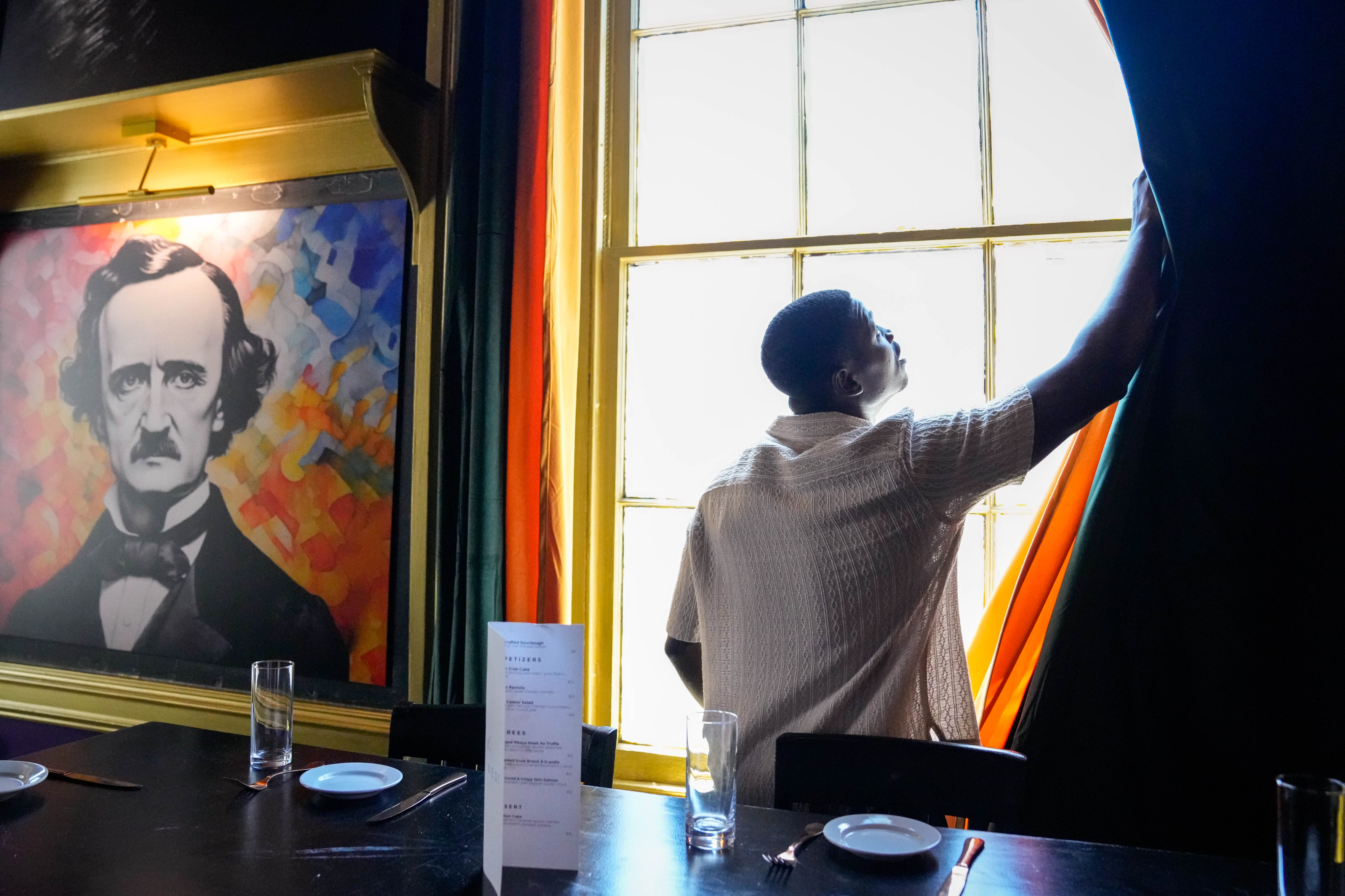 Chef and owner Loic Sany opens the blinds inside Nest, a fine-dining speakeasy located above his other restaurant, Jerk at Nite, in downtown Baltimore.