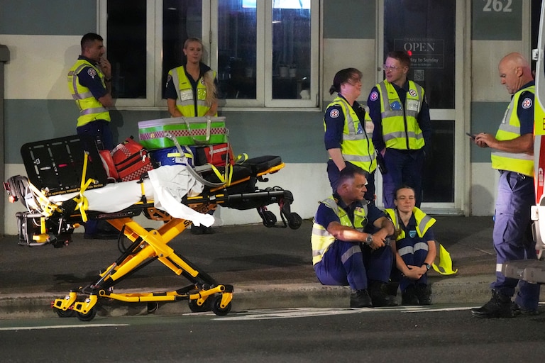 Emergency workers stand by at Bondi Beach after a reported shooting in Sydney.