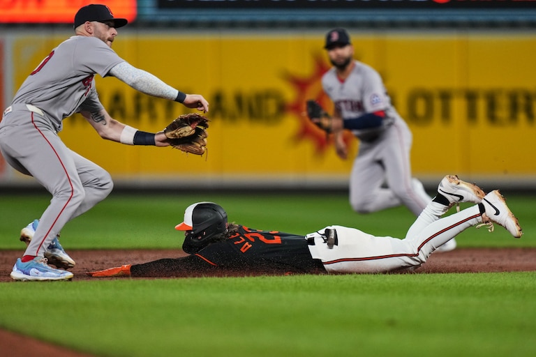 Baltimore Orioles' Blaze Alexander, right, steals second base in front of Boston Red Sox shortstop Trevor Story, left, during the third inning of a baseball game, Saturday, Sept. 5, 2026, in Baltimore. (AP Photo/Stephanie Scarbrough)