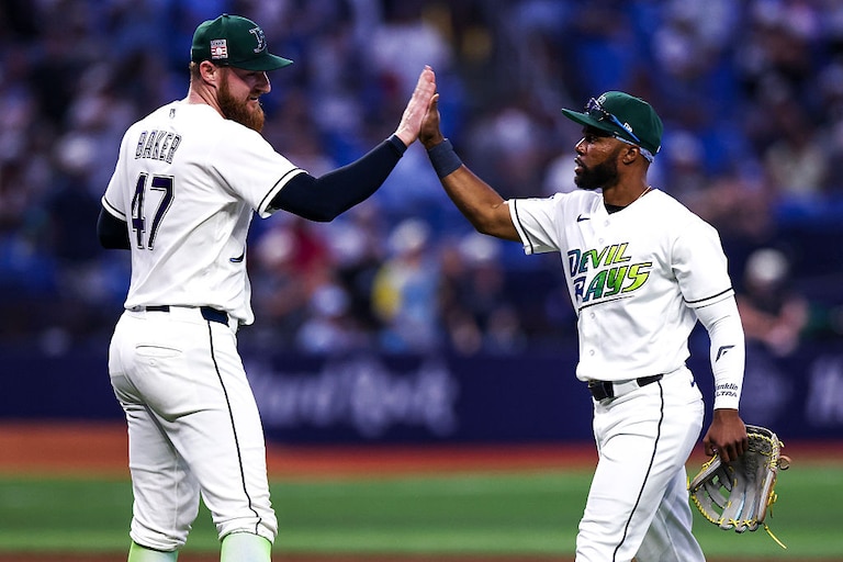 Bryan Baker, left, and Cedric Mullins celebrate the Tampa Bay Rays' win against the Cleveland Guardians on July 25.
