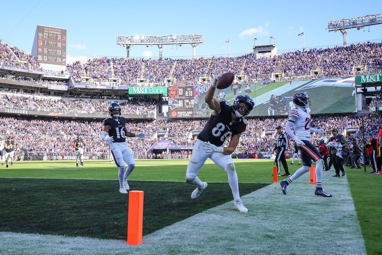 Baltimore Ravens tight end Charlie Kolar (88) spikes the football after catching a touchdown in the fourth quarter of a game against the Chicago Bears at M&T Bank Stadium in Baltimore, Md., on Sunday, Oct. 26, 2025.