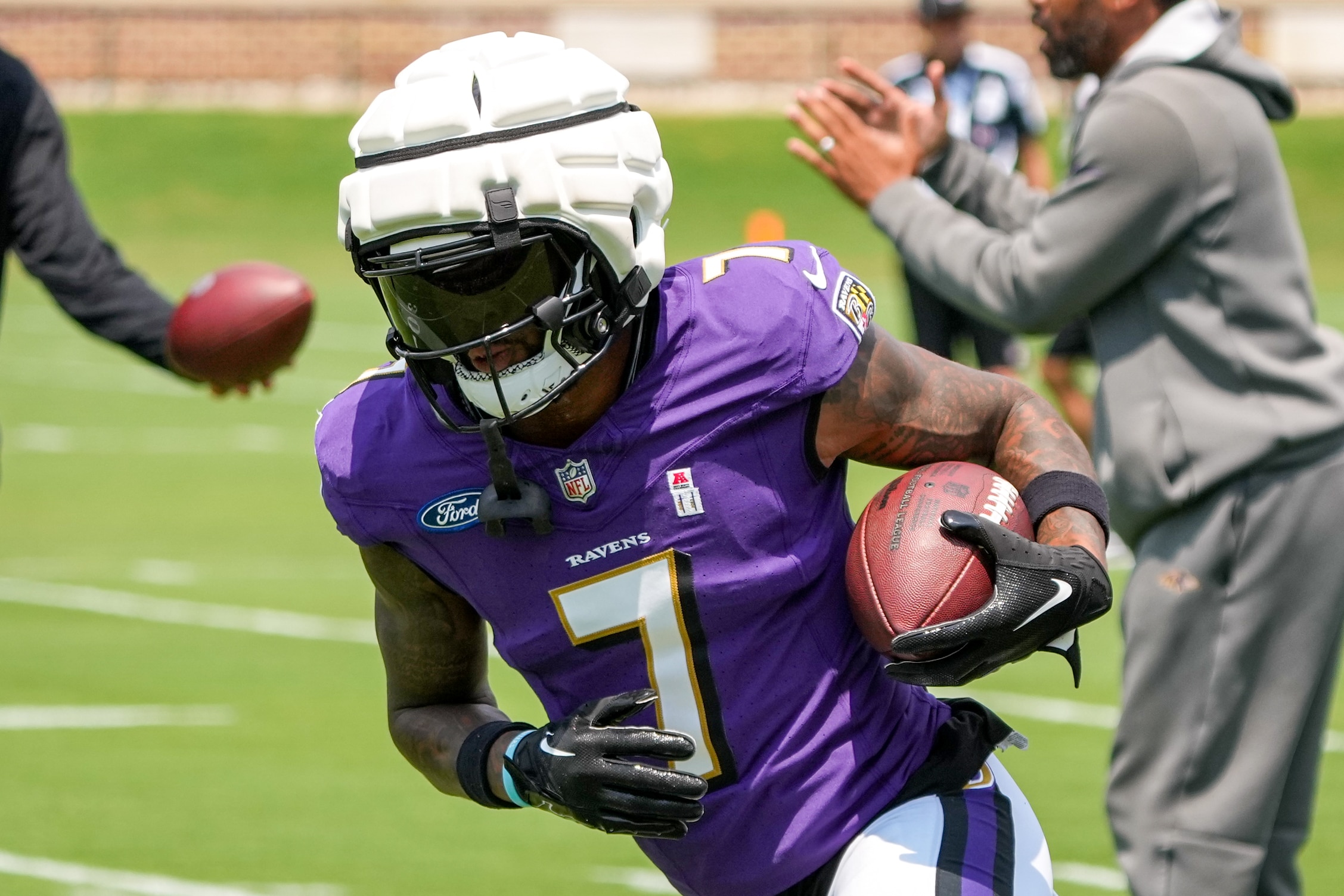 Wide receiver Rashod Bateman runs after the catch at Ravens training camp Thursday.