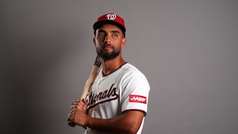 Washington Nationals catching prospect Harry Ford poses with a bat on his shoulder.