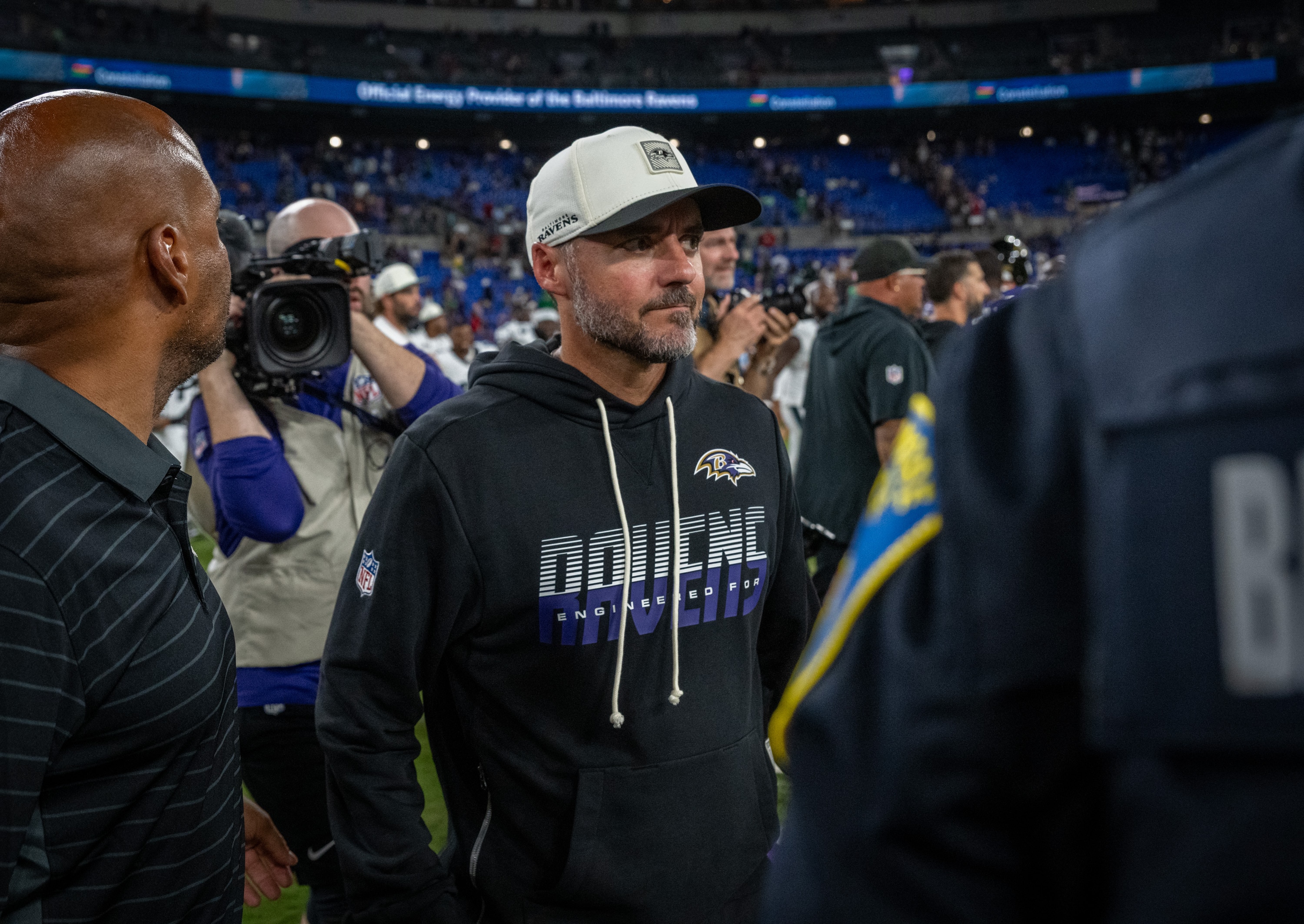 Ravens coach Jesse Minter walks off the field after Saturday night’s 24-7 preseason win over the Eagles.