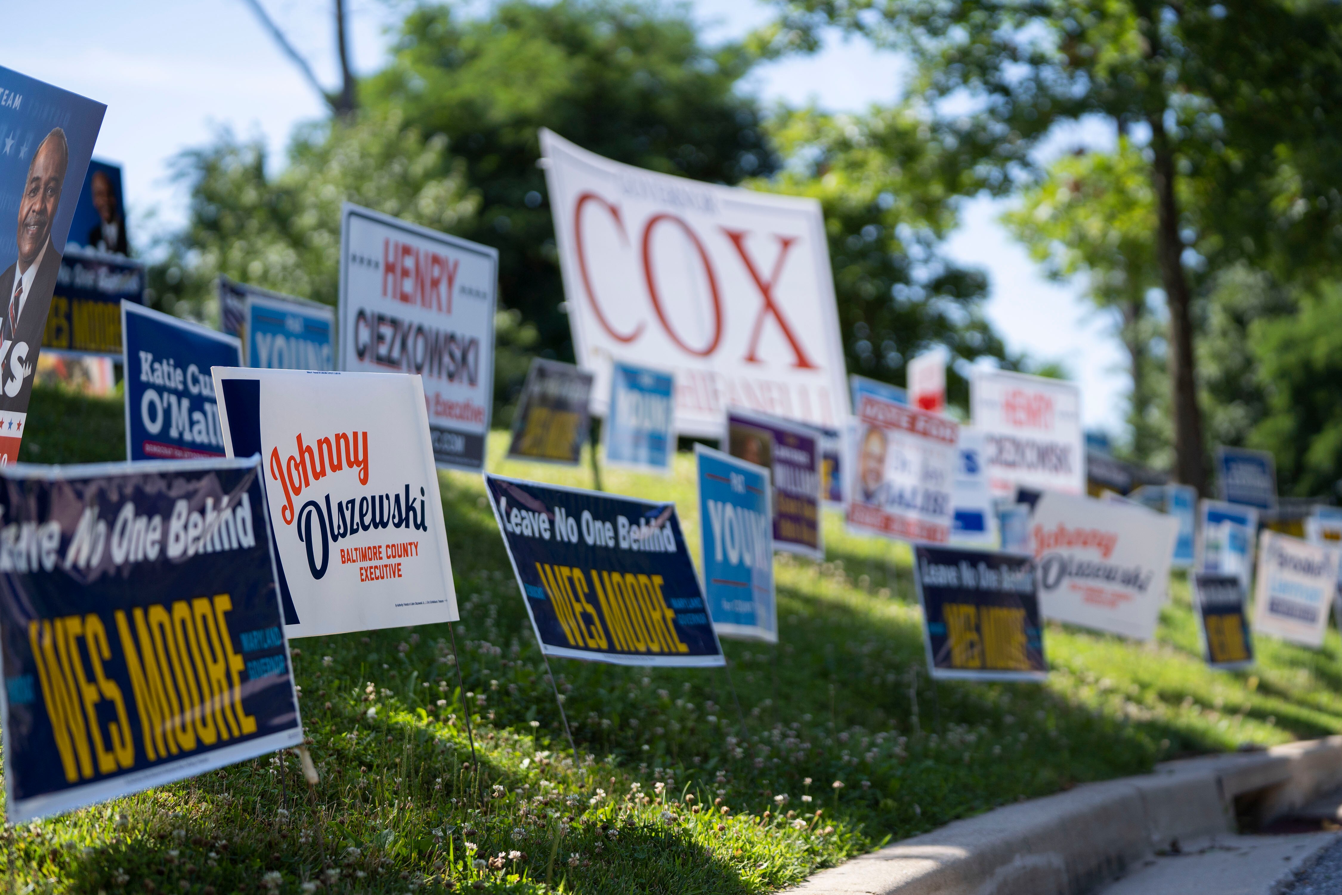 Campaign signs line the road leading to Arbutus Recreation Center, an early voting location in Baltimore County.