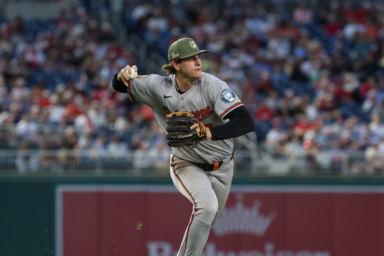 Baltimore Orioles third baseman Coby Mayo throws to first base for an out on a ball hit by Washington Nationals' Jacob Young during the fifth inning of a baseball game, Friday, May 15, 2026, in Washington.