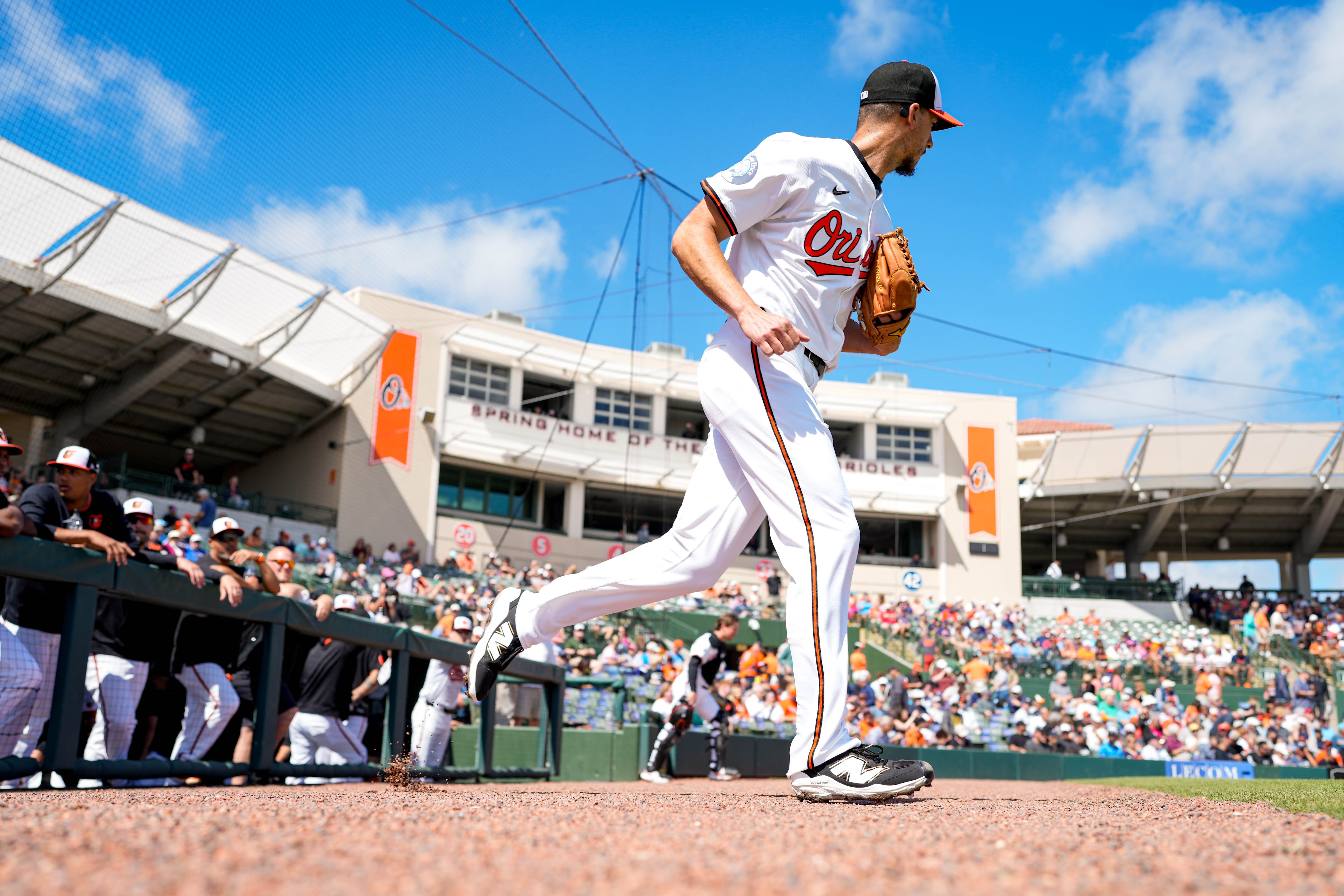 Orioles pitcher Charlie Morton takes the field with catcher Adley Rutschman ahead of a Grapefruit League game against the Detroit Tigers.