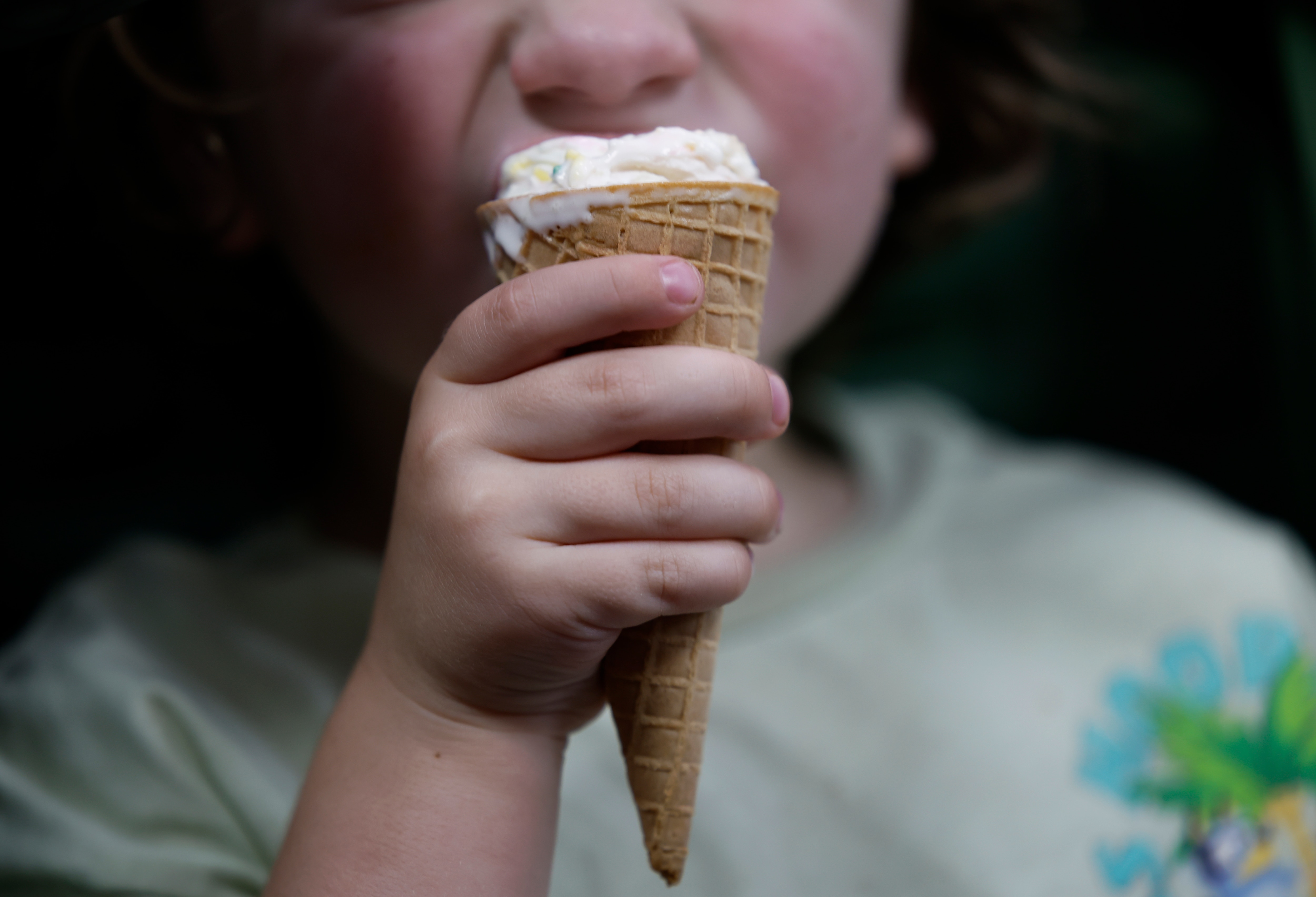 Emerson Warner, 2, enjoys a confetti cupcake scoop of ice cream at Franklins Ice Cream in Hyattsville.