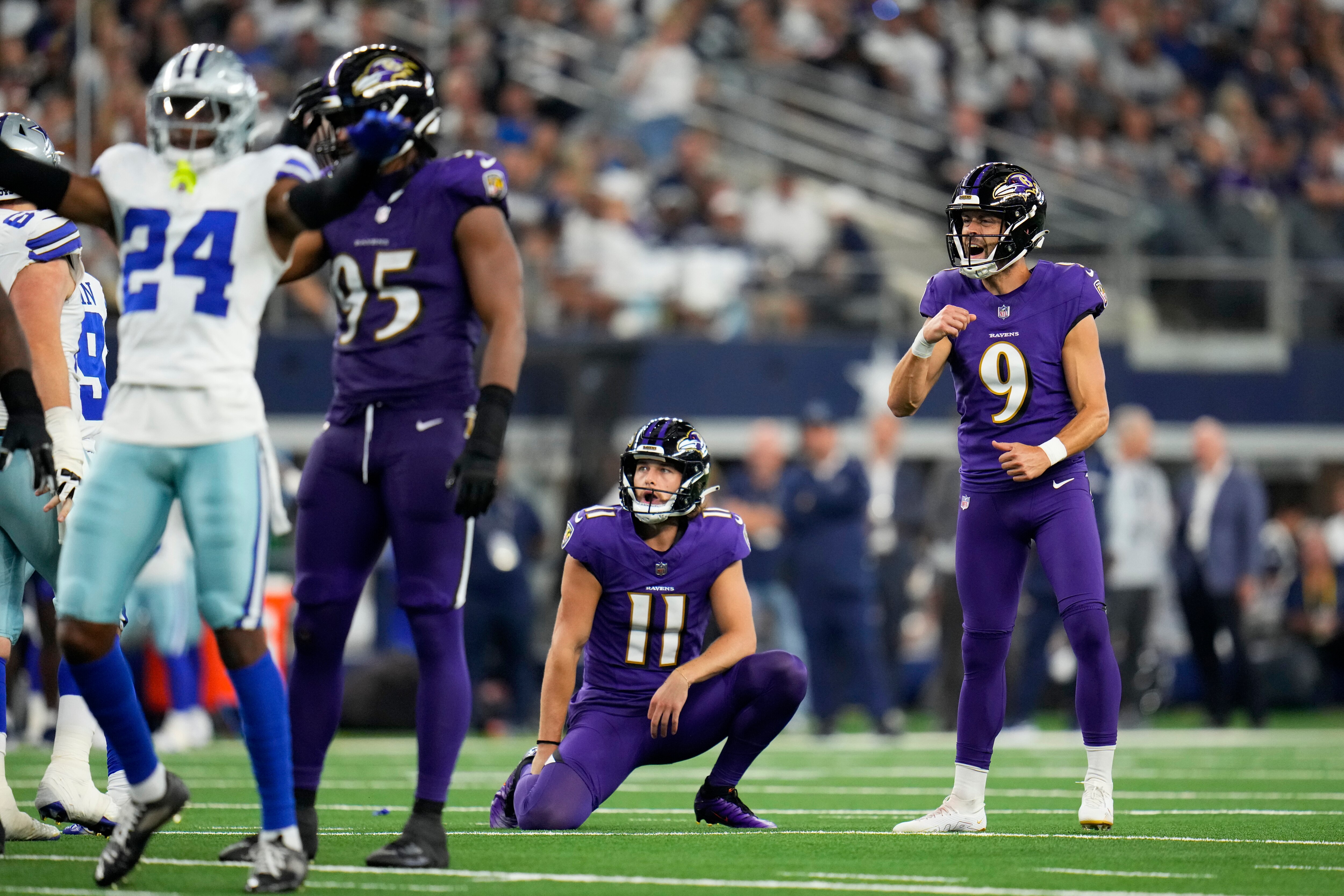 Ravens placeholder Jordan Stout and kicker Justin Tucker watch a 46-yard field goal try miss to the left in the fourth quarter against the Cowboys.