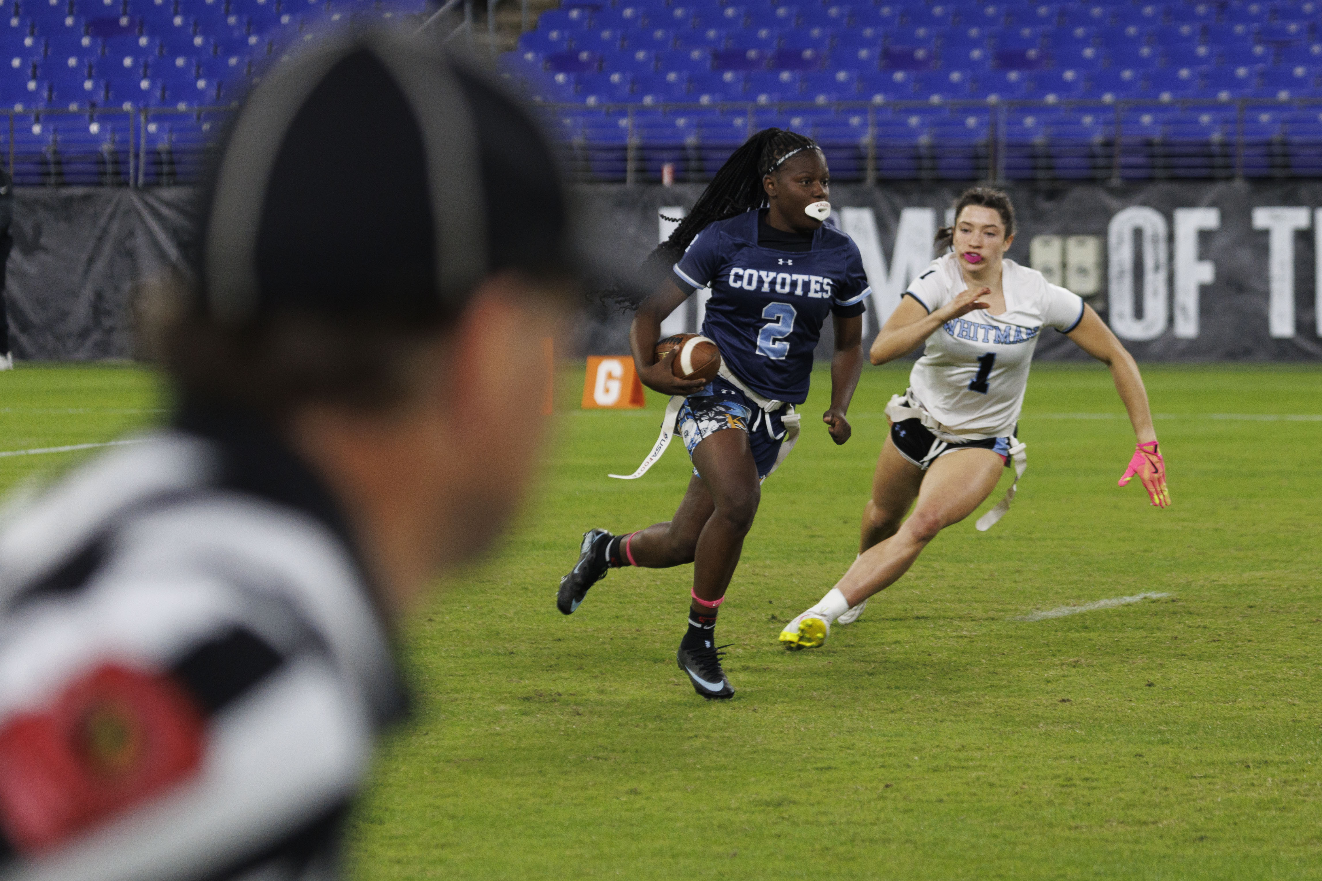 Clarkburg's Aysia Jones Robinson runs with the ball as Whitman's Charlotte Dorsey chases.